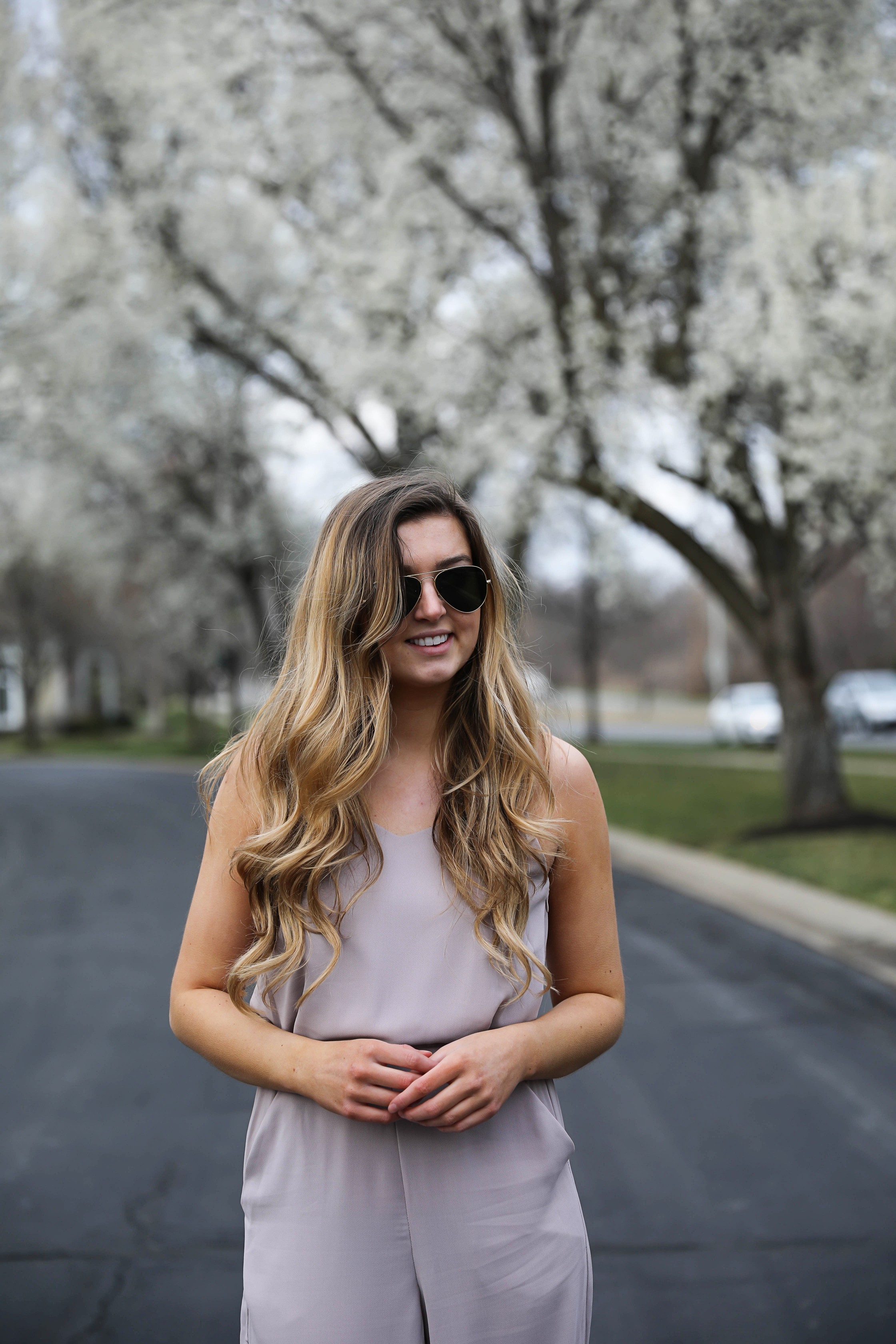 Light Pink Flowy Jumpsuit! Paired with the cutest tied flats and ray ban aviators! By Lauren Lindmark on Daily Dose of Charm dailydoseofcharm.com