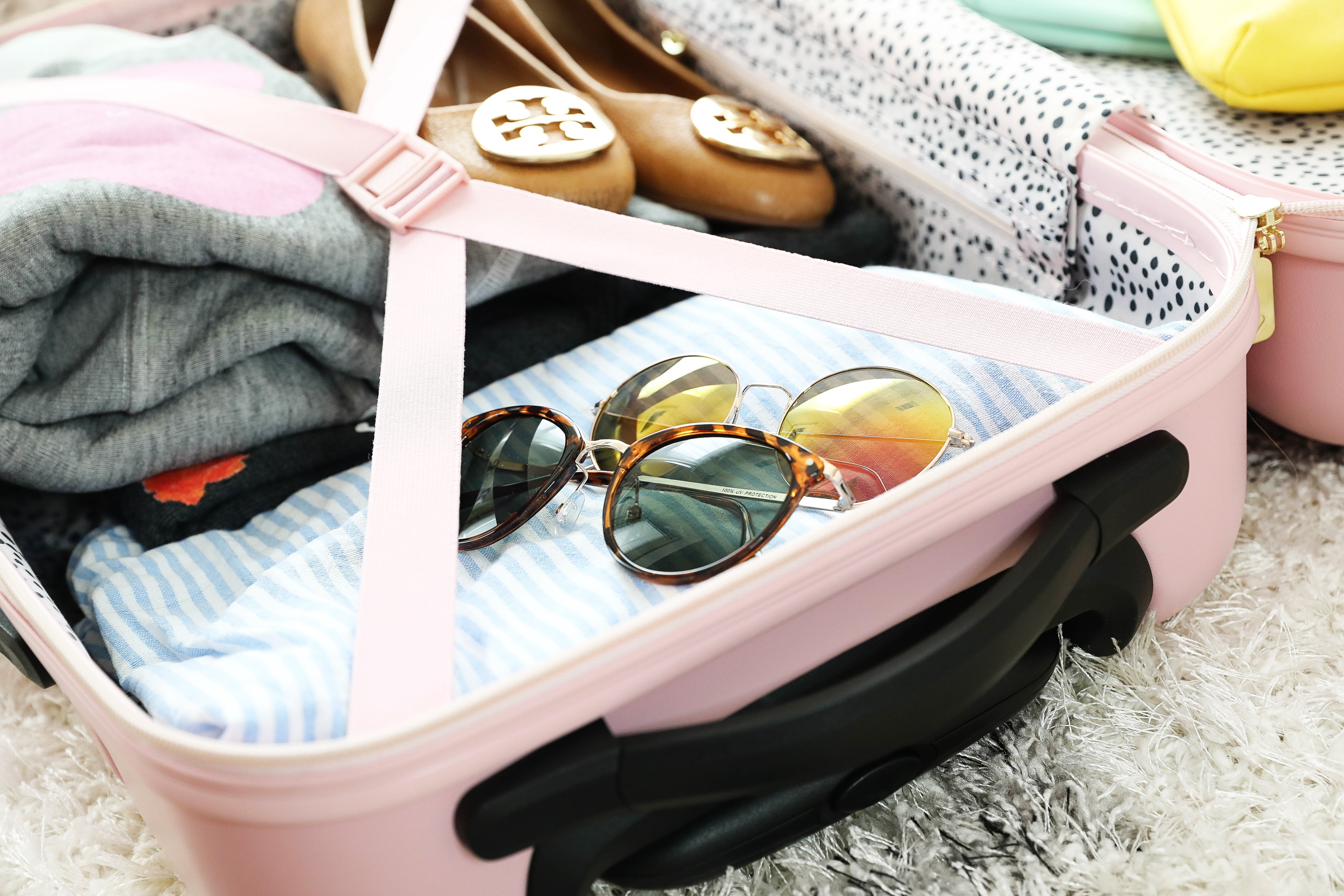 Packing tips and travel tips for frequent flyers! How to travel easier plus cute suitcases. On the blog Daily Dose of Charm by Lauren Lindmark dailydoseofcharm.com