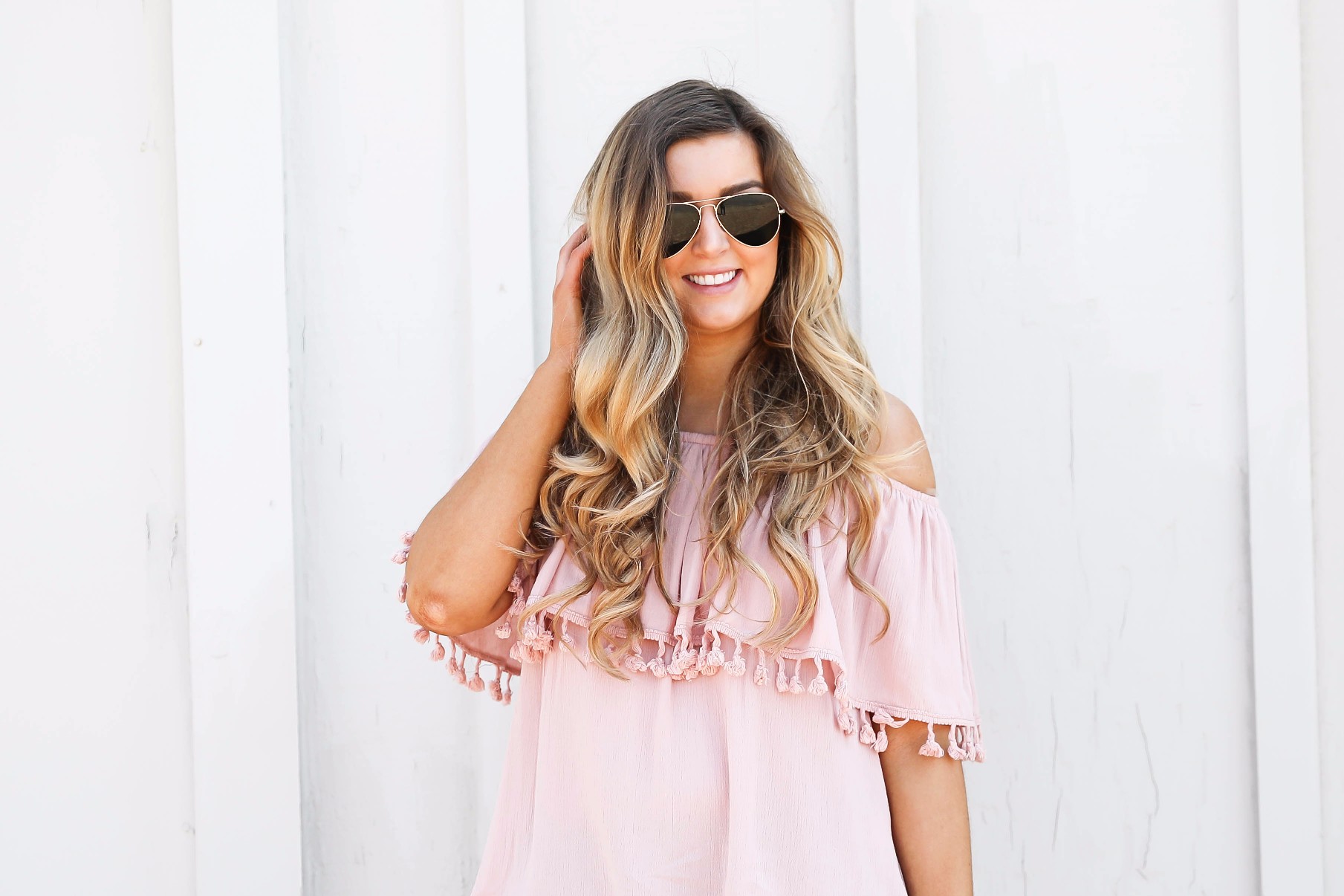 Pink ruffle pom pom top with jean shorts. This is the cutest spring outfit ever! I love the ruffle trend! on Daily Dose of Charm by Lauren Lindmark dailydoseofcharm.com