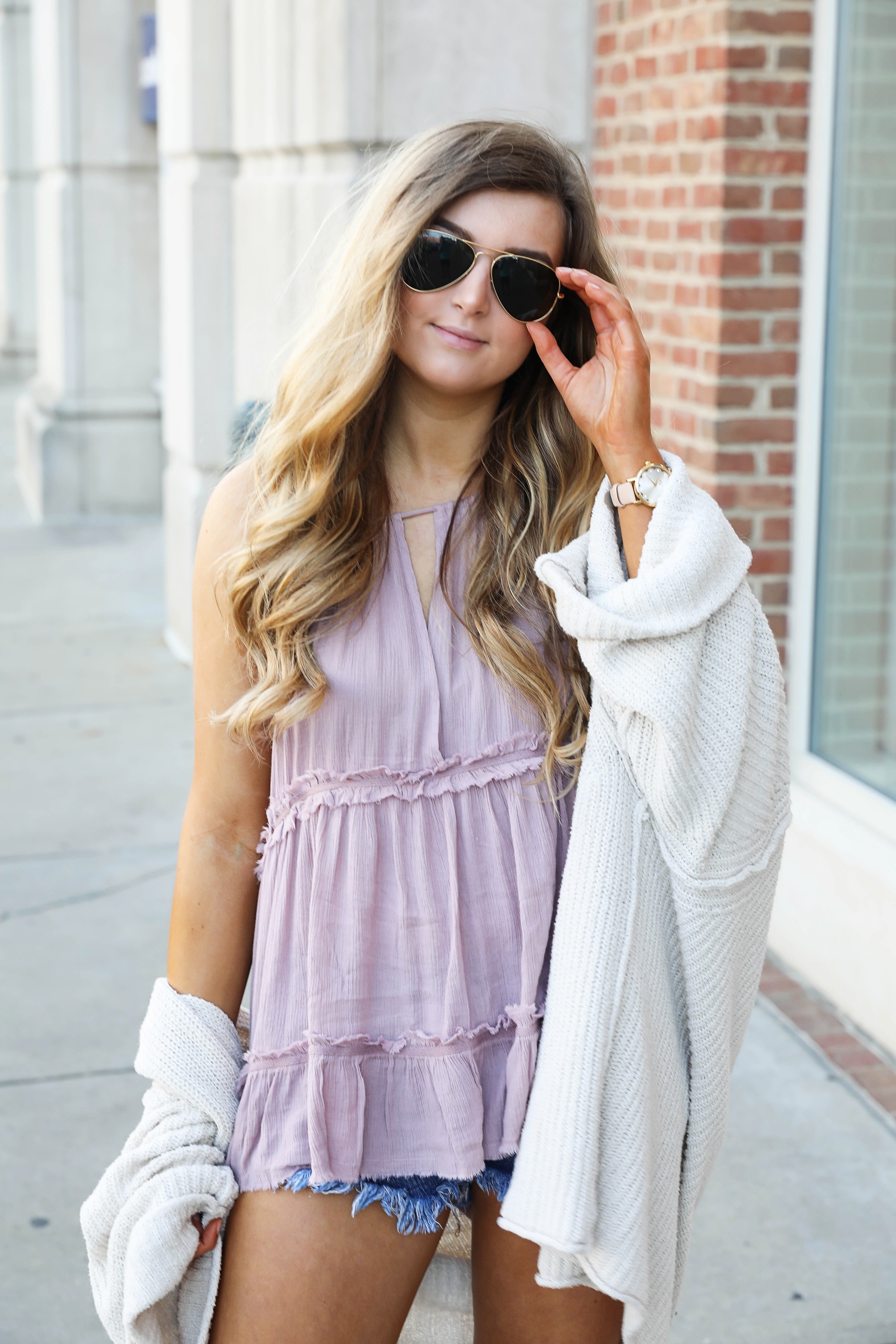 The perfect spring outfit! A purple flowy top paired with a slouchy Free People cardigan on Daily Dose of Charm by Lauren Lindmark dailydoseofcharm.com