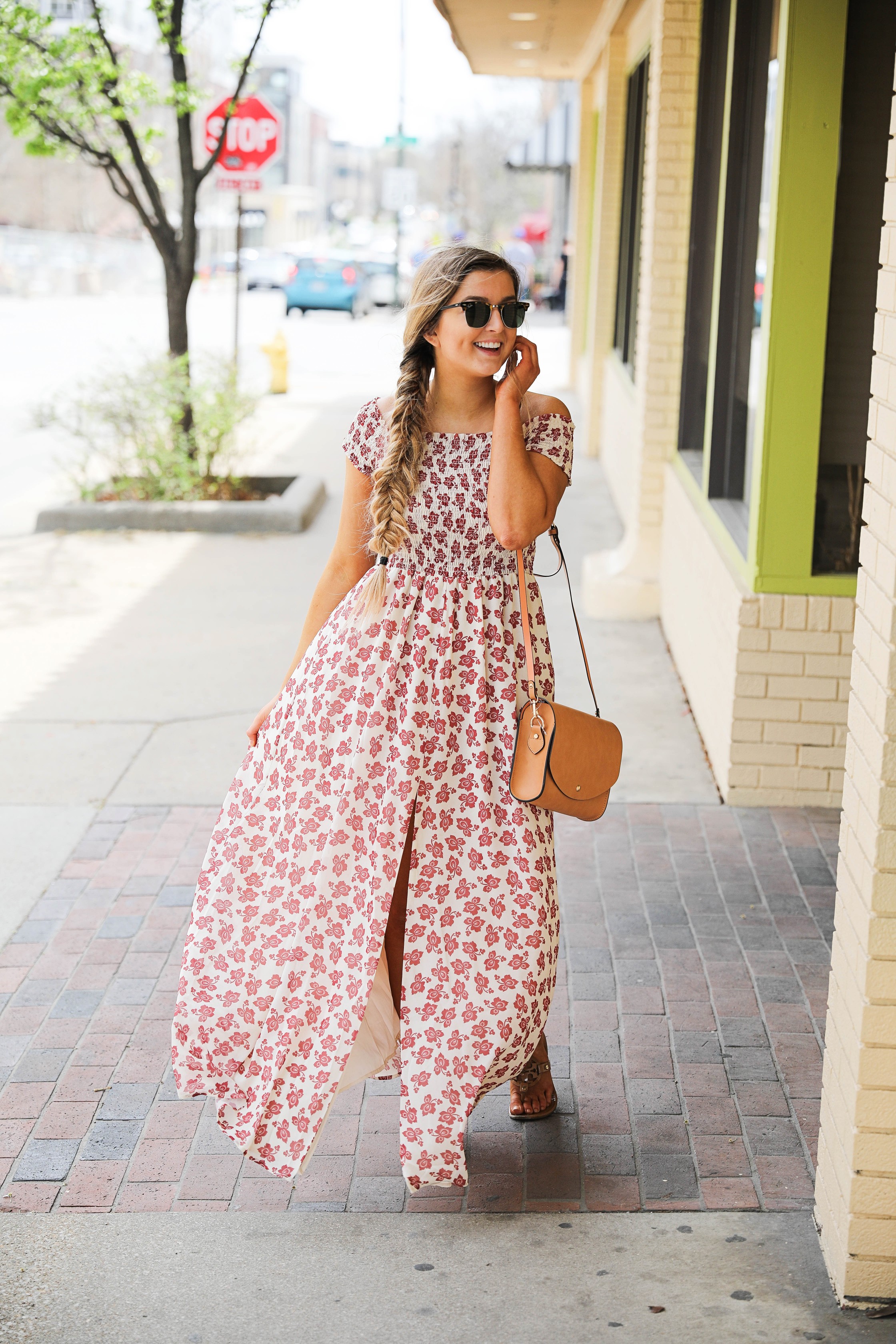 The prettiest floral off the shoulder dress for spring and summer! I am a sucker for a cute floral dress. I love the slit on the front of this dress and I paired it with a brown leather bag and sunglasses! By Lauren Lindmark on daily dose of charm dailydoseofcharm.com