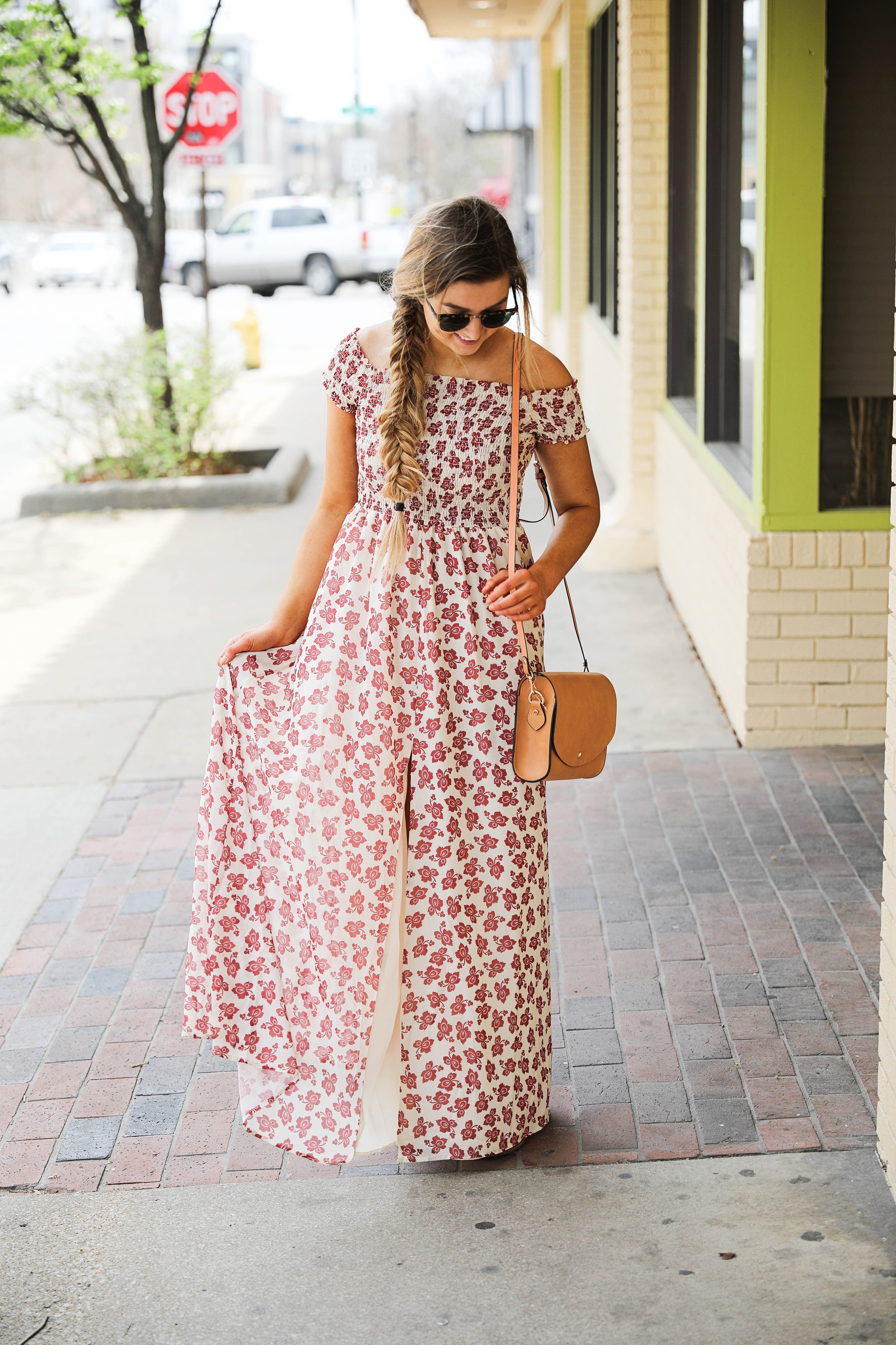 The prettiest floral off the shoulder dress for spring and summer! I am a sucker for a cute floral dress. I love the slit on the front of this dress and I paired it with a brown leather bag and sunglasses! By Lauren Lindmark on daily dose of charm dailydoseofcharm.com