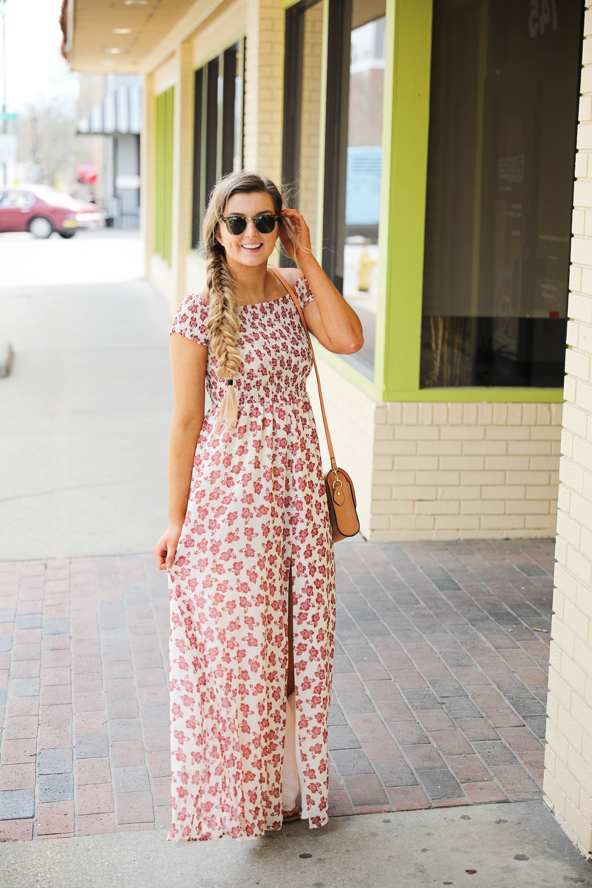 The prettiest floral off the shoulder dress for spring and summer! I am a sucker for a cute floral dress. I love the slit on the front of this dress and I paired it with a brown leather bag and sunglasses! By Lauren Lindmark on daily dose of charm dailydoseofcharm.com