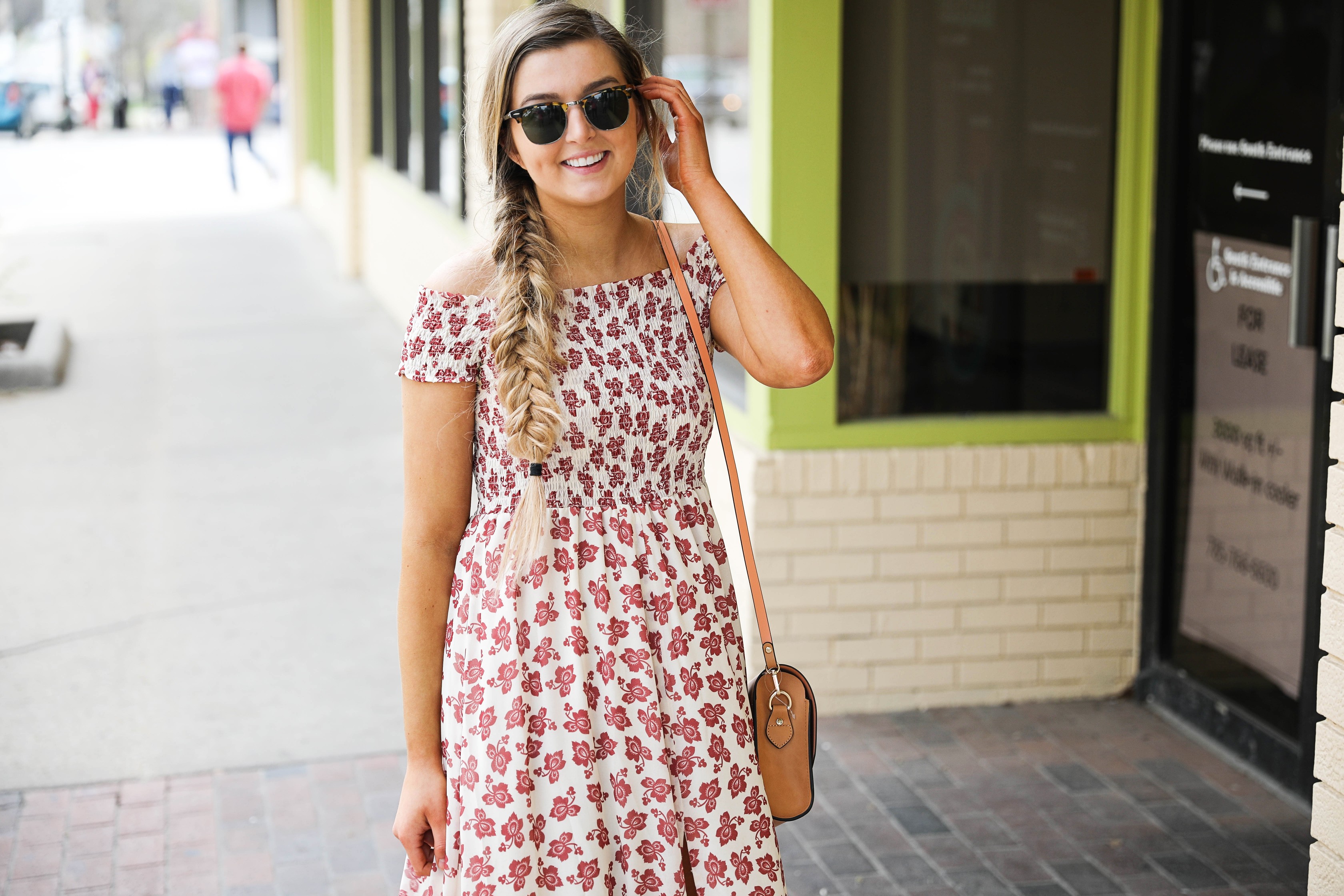 The prettiest floral off the shoulder dress for spring and summer! I am a sucker for a cute floral dress. I love the slit on the front of this dress and I paired it with a brown leather bag and sunglasses! By Lauren Lindmark on daily dose of charm dailydoseofcharm.com