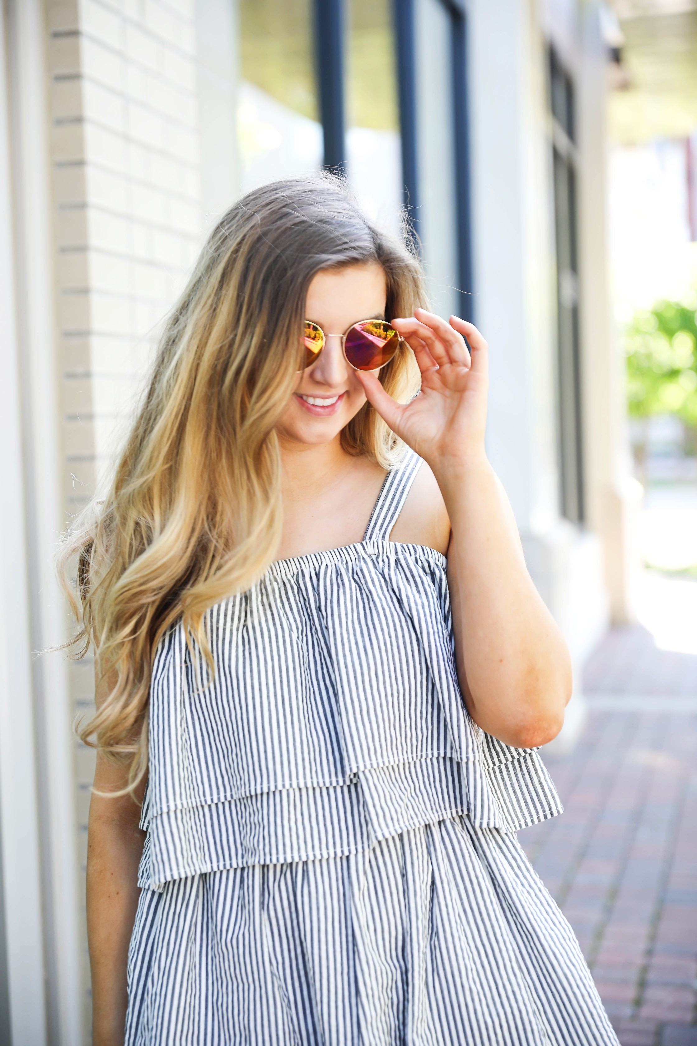 Striped ruffle dress with circle sunglasses and brown leather sandals! By Lauren Lindmark on dailydoseofcharm.com fashion blog daily dose of charm