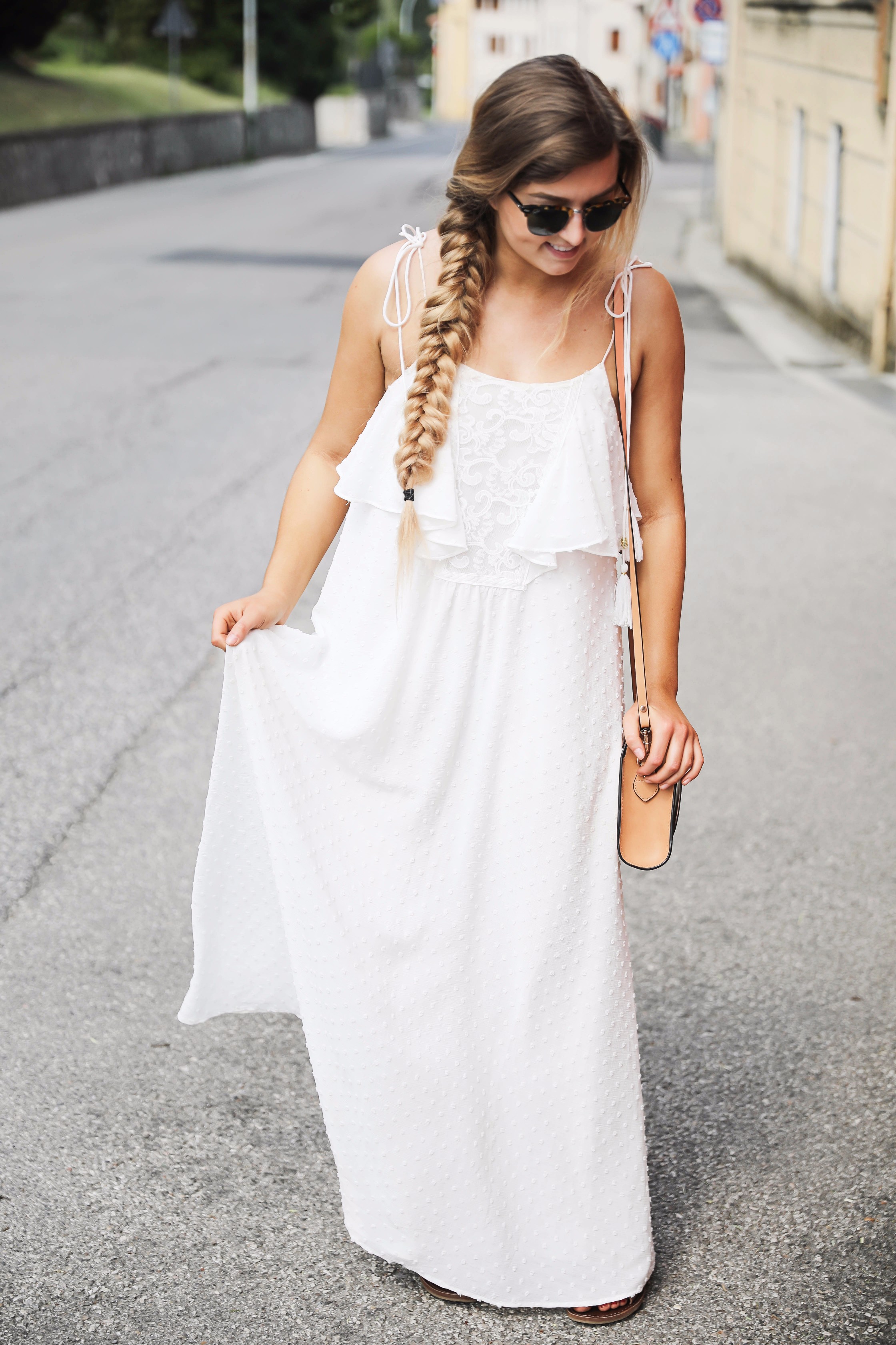 White flowy maxi dress with long fishtail braid in Paderno del Grappa, Italy by fashion blogger Lauren Lindmark daily dose of charm dailydoseofcharm.com