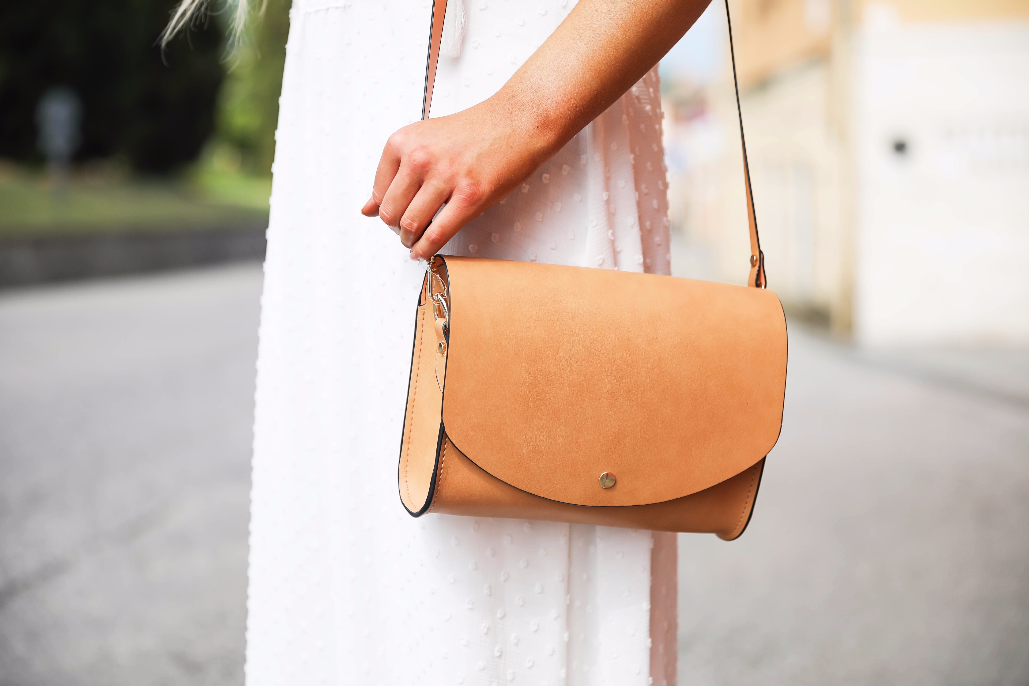 White flowy maxi dress with long fishtail braid in Paderno del Grappa, Italy by fashion blogger Lauren Lindmark daily dose of charm dailydoseofcharm.com