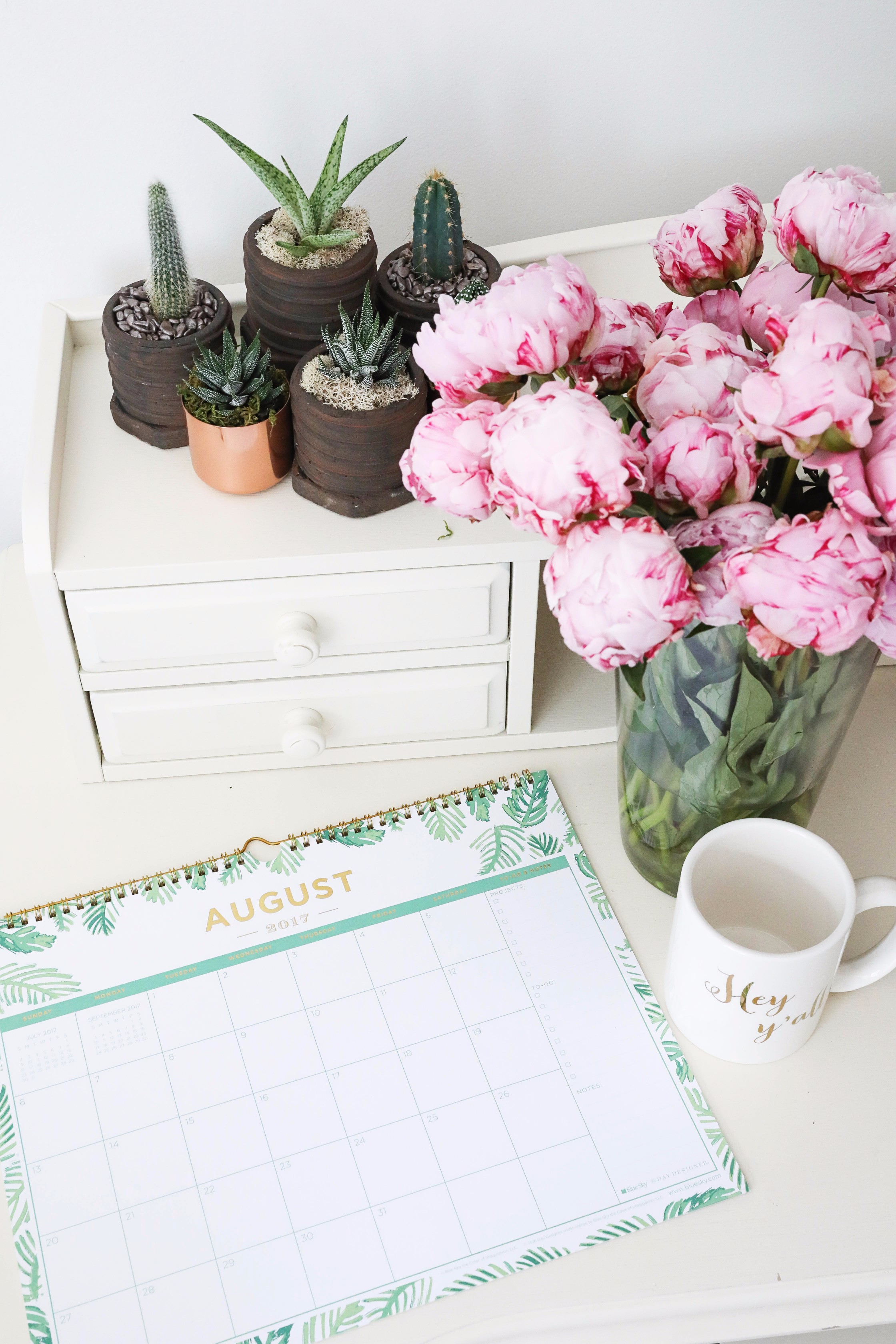 Pink peonies, cactus and succulents, and palm leaf calendar on June favorites by fashion and lifestyle blogger lauren lindmark on daily dose of charm