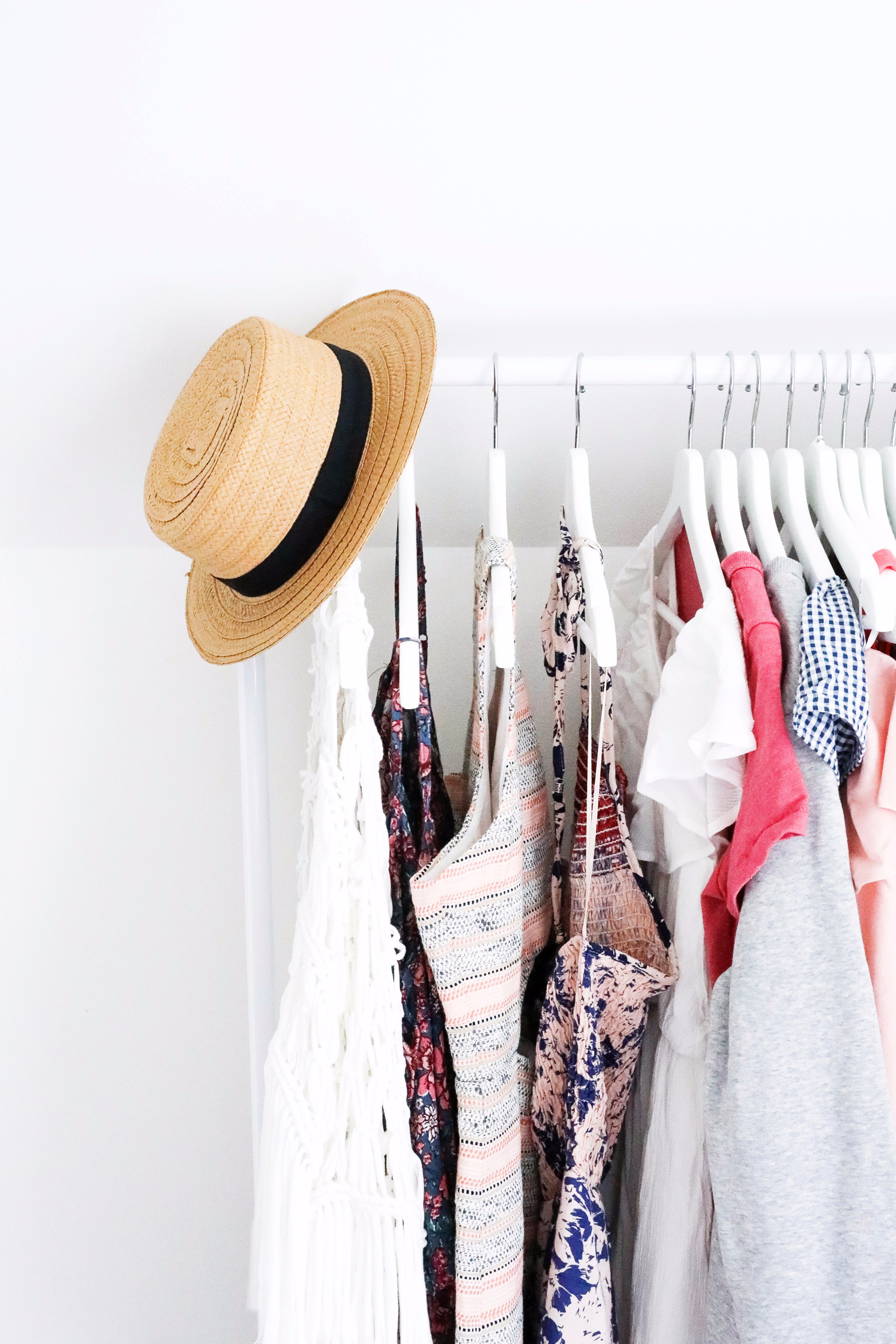 Hat and clothing rack June favorites by fashion and lifestyle blogger lauren lindmark on daily dose of charm