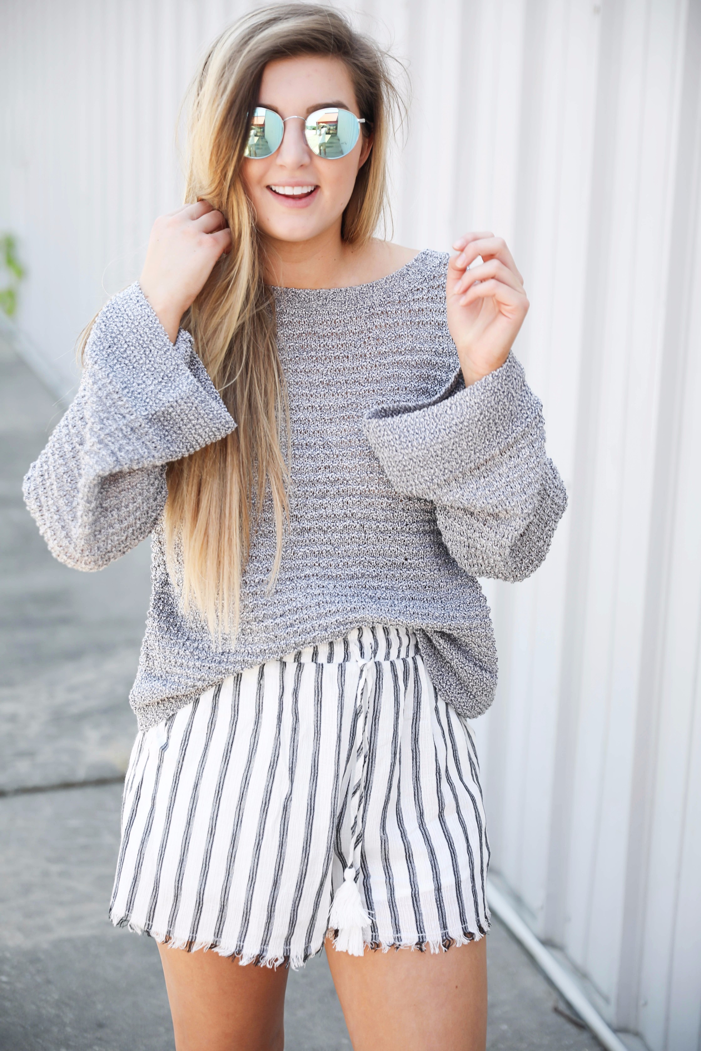 Open back sweater with striped nautical shorts by lauren lindmark on fashion blog daily dose of charm