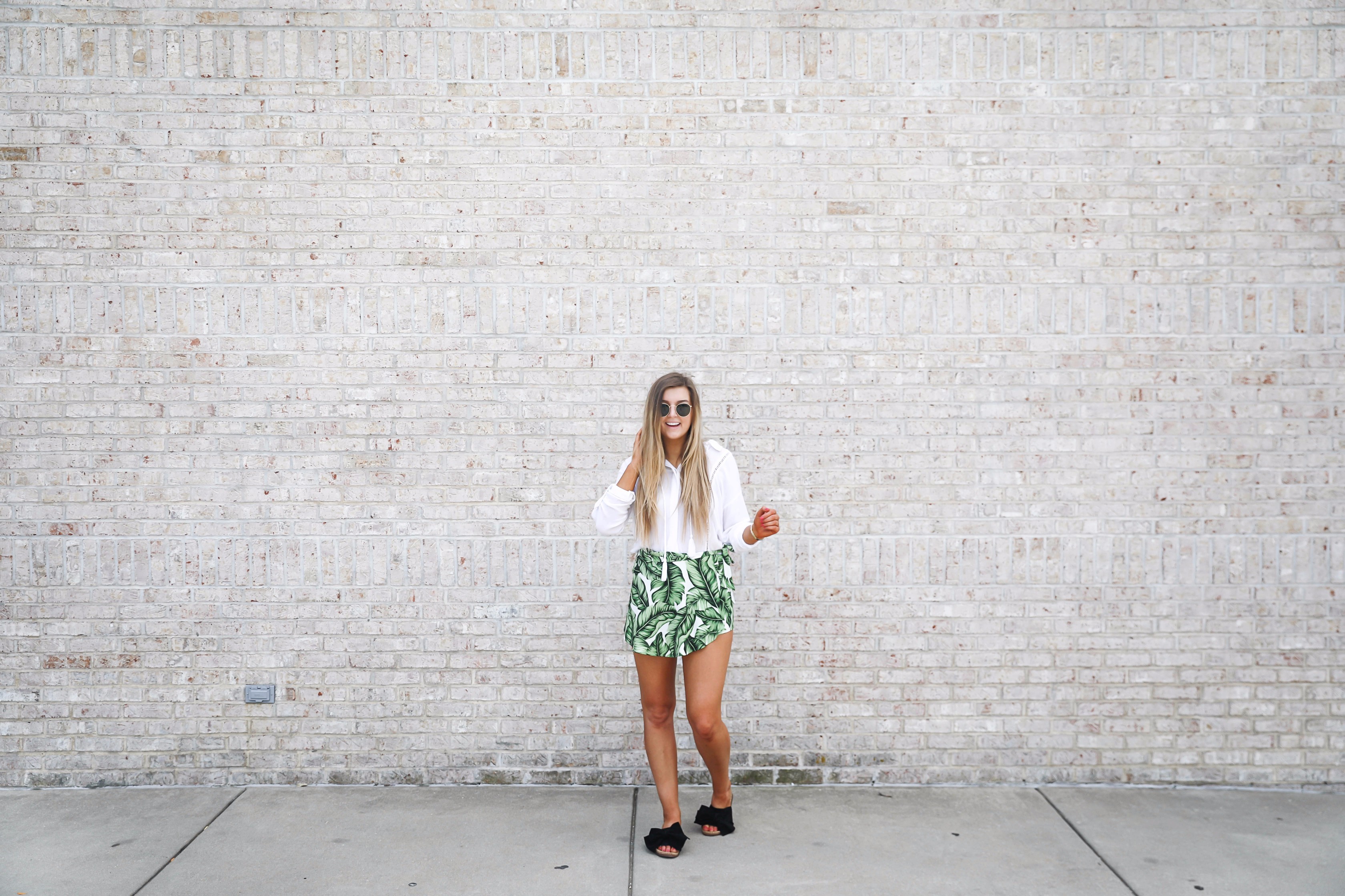 Palm leaf skort y show me your mumu with flowy a white tassel top perfect outfit for summer days! on fashoin blog daily dose of charm by lauren lindmark