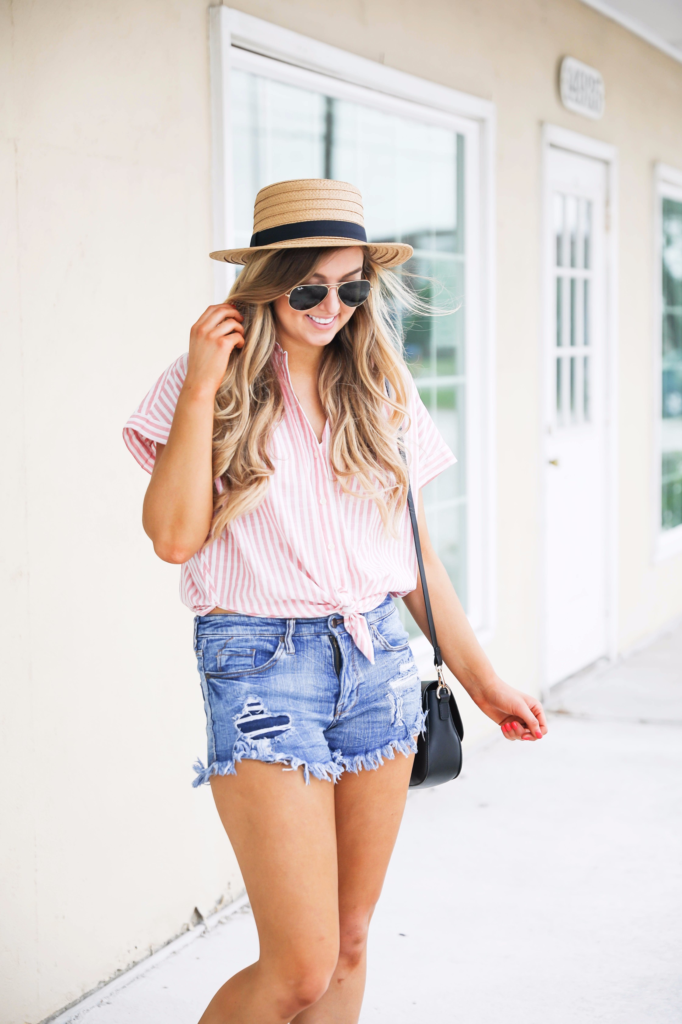 Striped red button up fourth of july outfit with Straw Boater hat by fashion blog daily dose of charm lauren lindmark