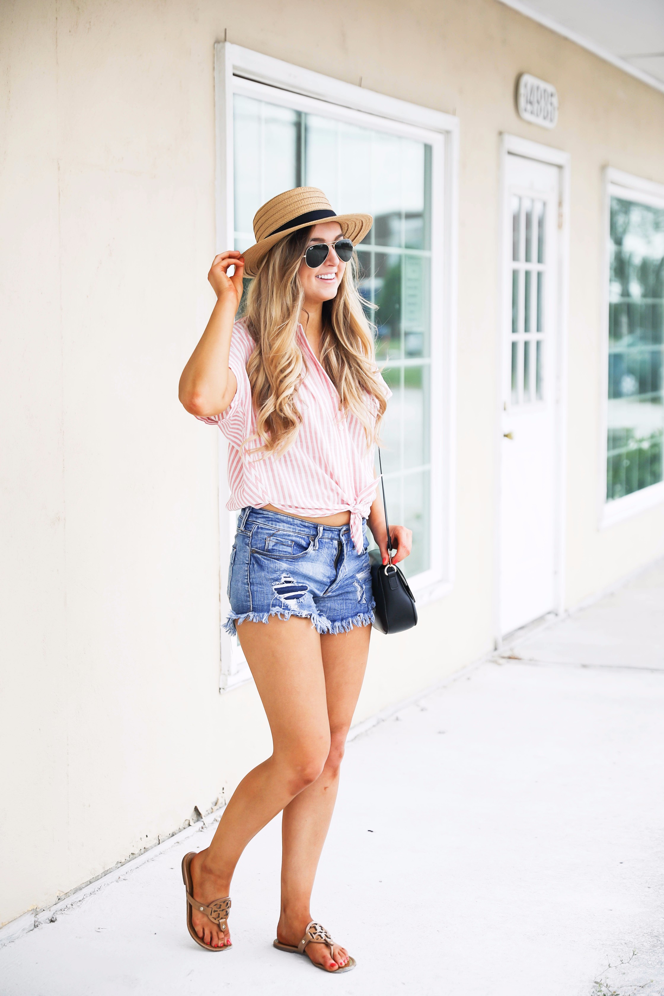 Striped red button up fourth of july outfit with Straw Boater hat by fashion blog daily dose of charm lauren lindmark