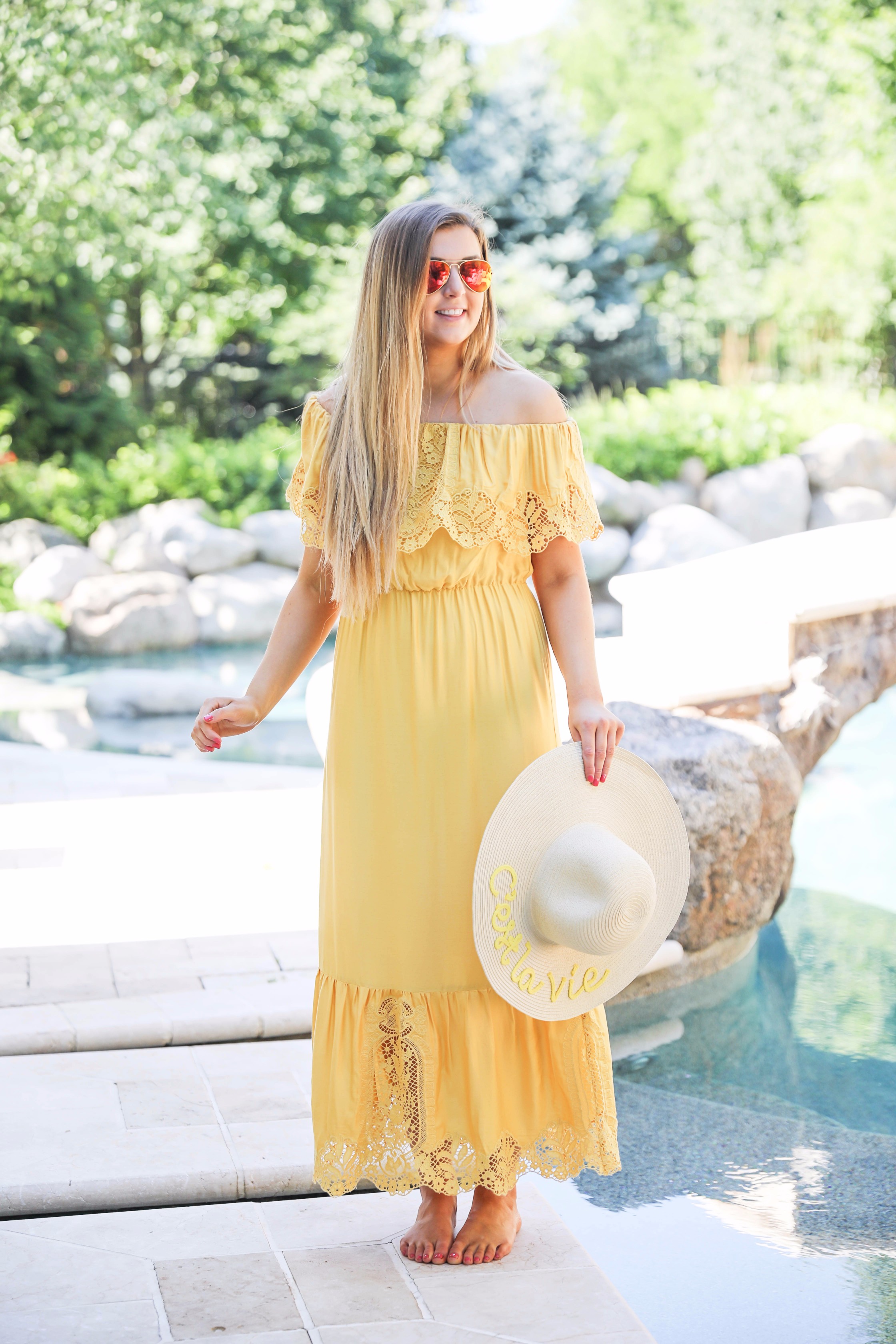 Yellow midi maxi dress poolside with cest la vie quote sun hat on fashion blog daily dose of charm by lauren lindmark