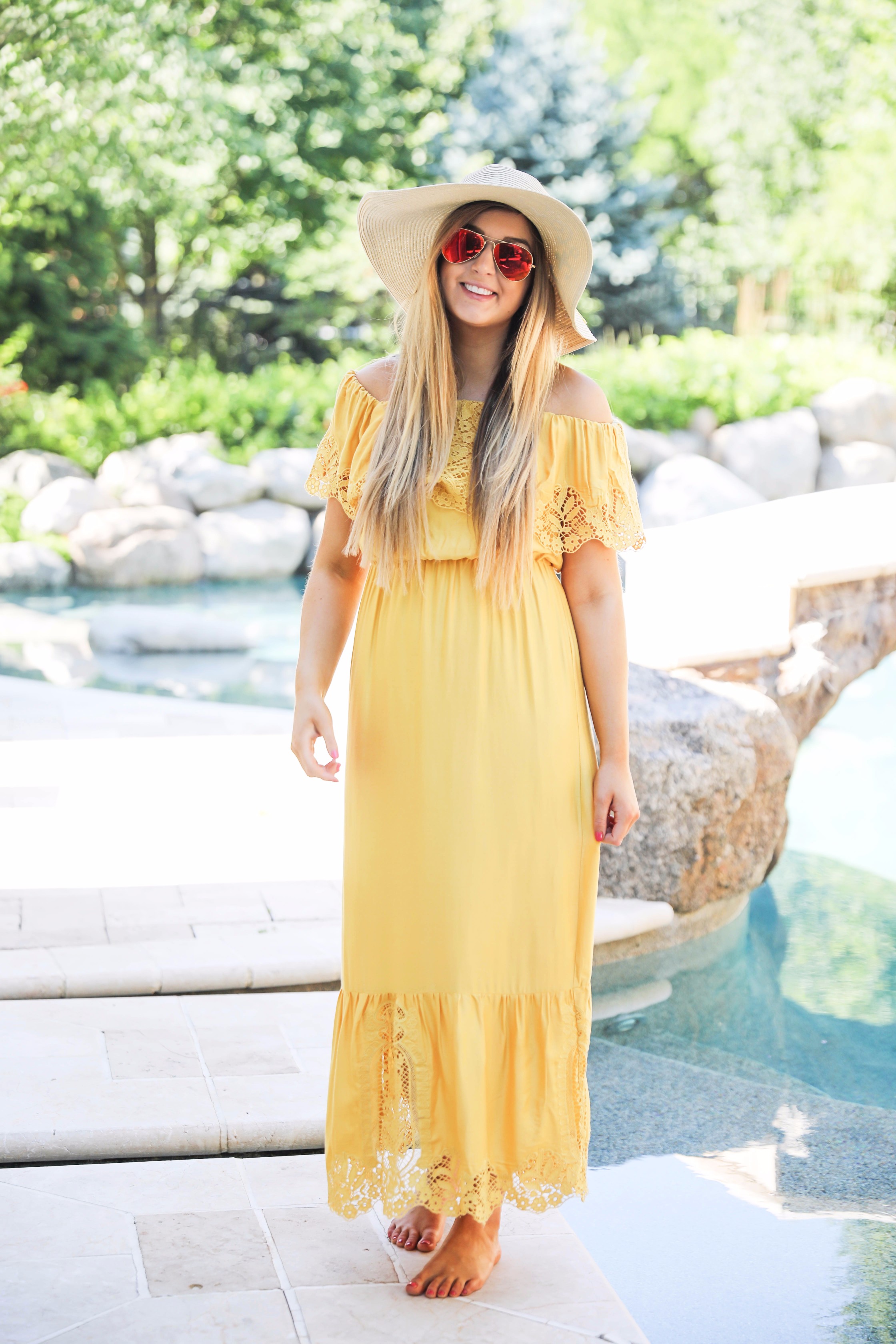 Yellow midi maxi dress poolside with cest la vie quote sun hat on fashion blog daily dose of charm by lauren lindmark