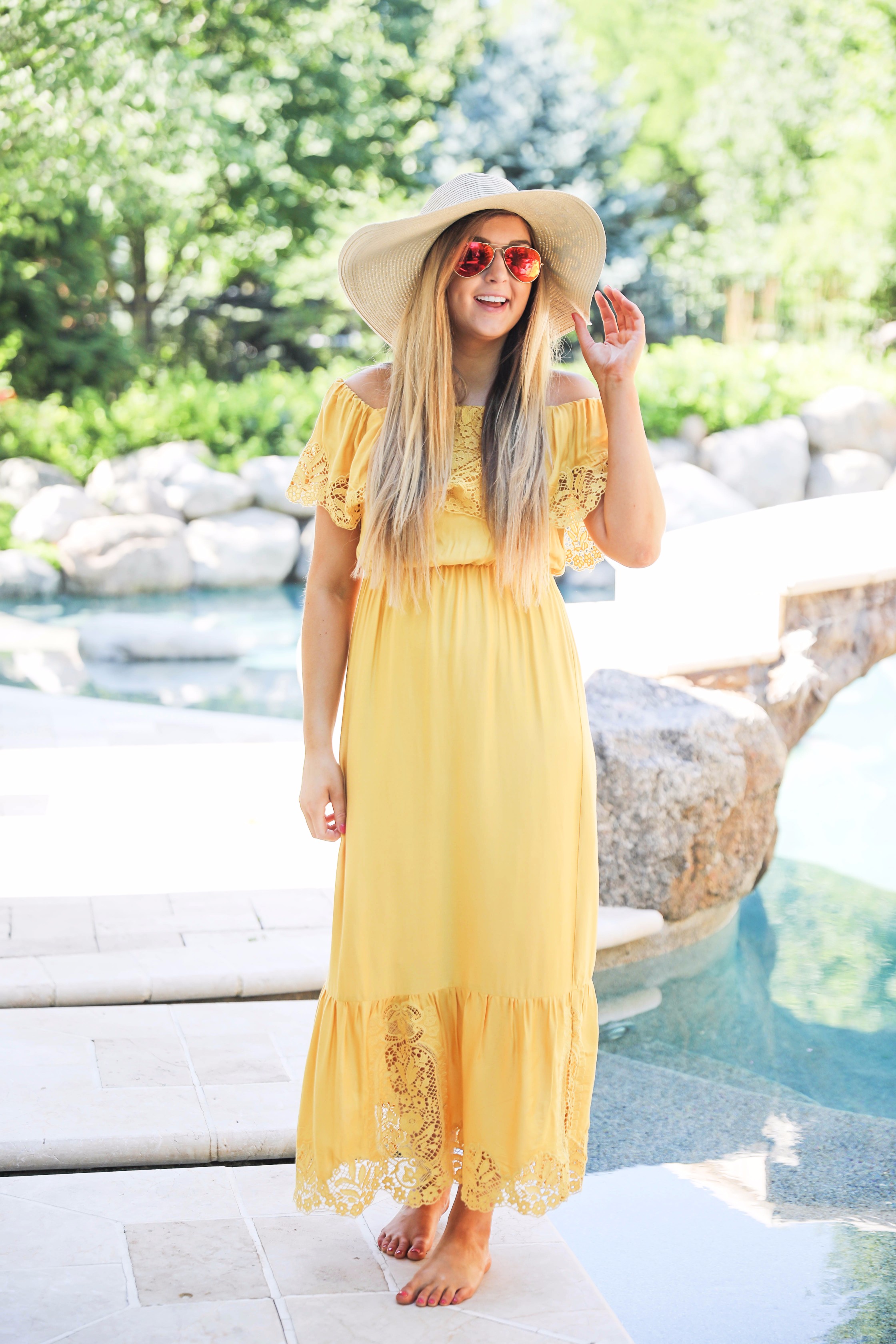 Yellow midi maxi dress poolside with cest la vie quote sun hat on fashion blog daily dose of charm by lauren lindmark