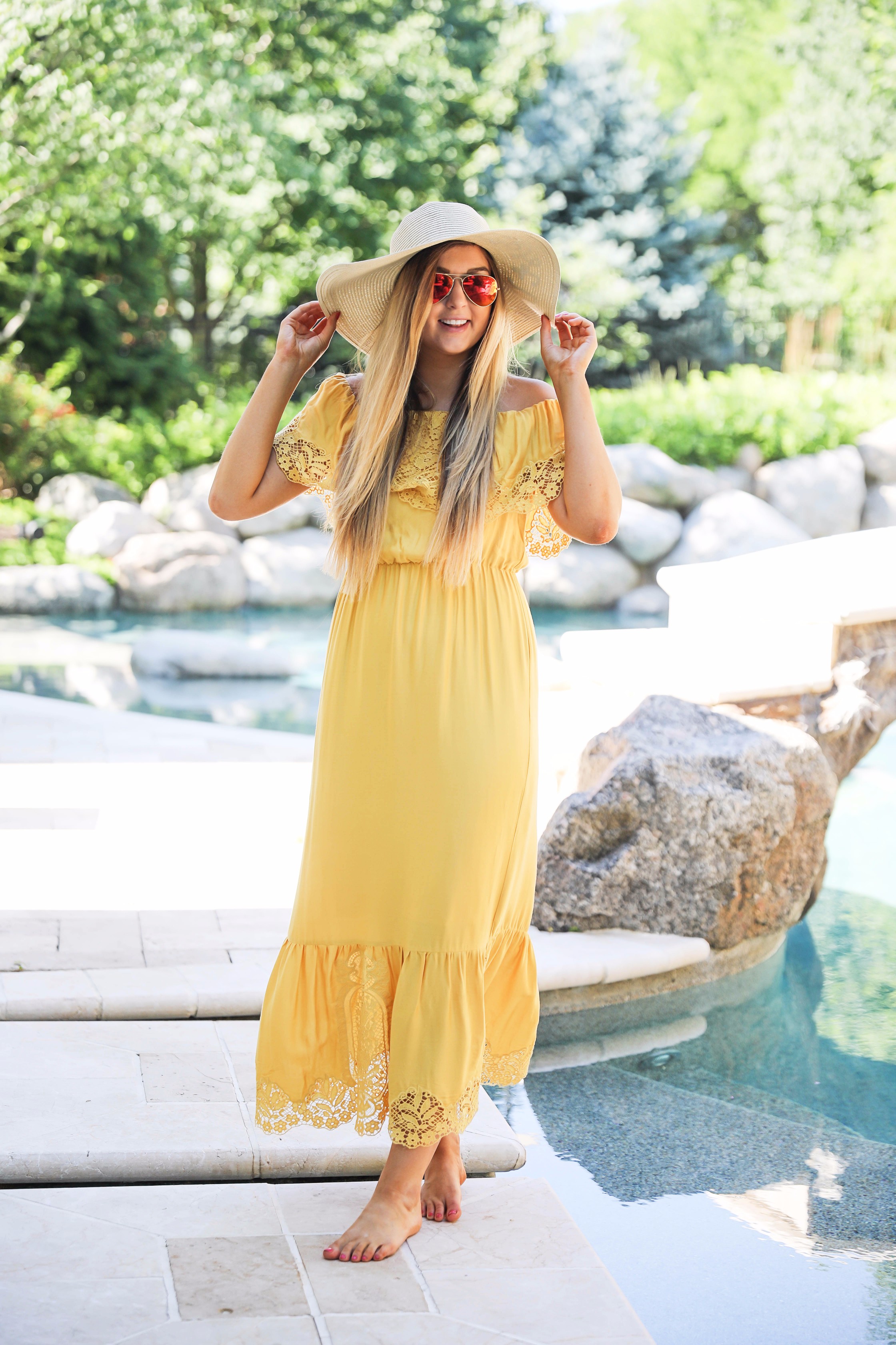 Yellow midi maxi dress poolside with cest la vie quote sun hat on fashion blog daily dose of charm by lauren lindmark