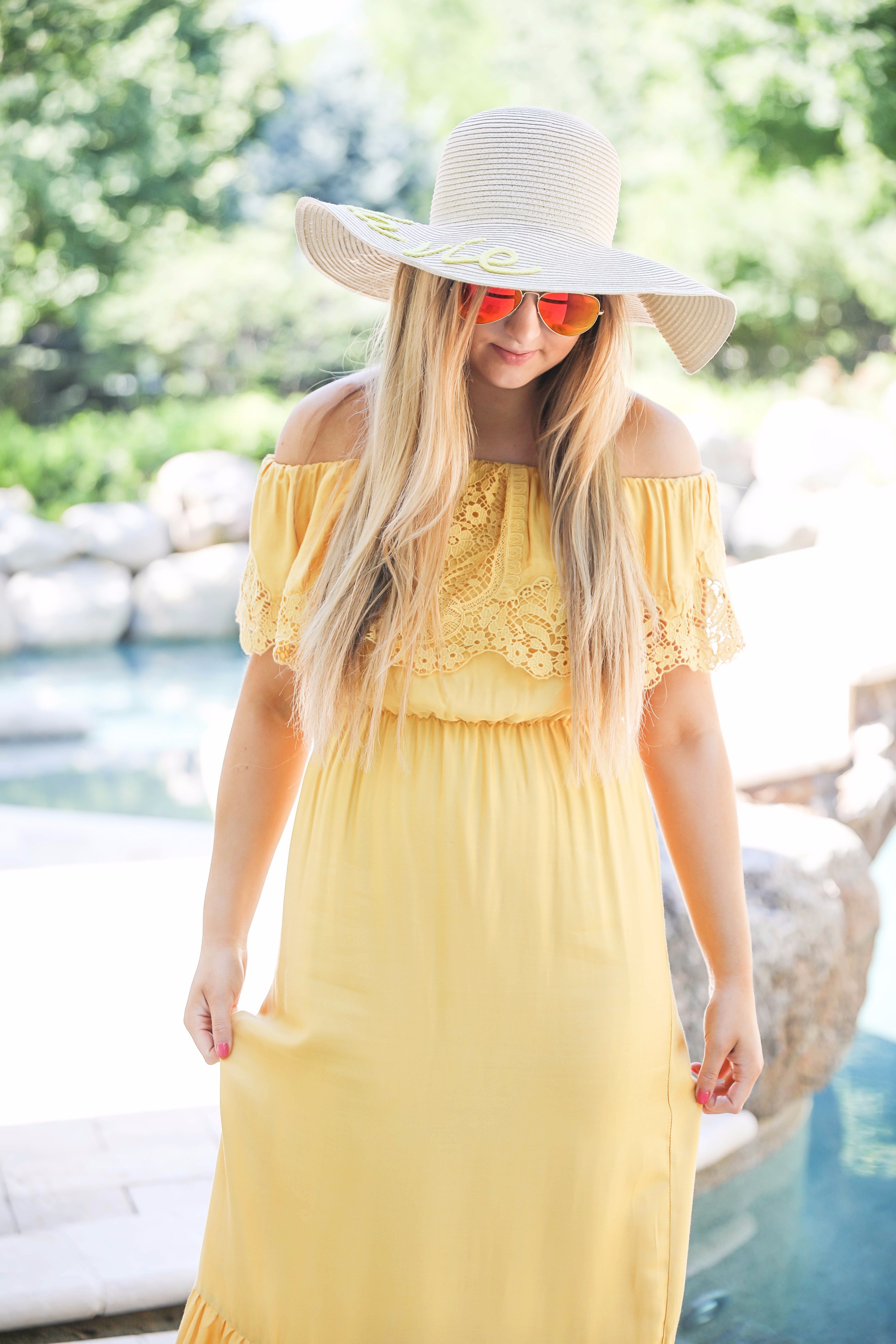 Yellow midi maxi dress poolside with cest la vie quote sun hat on fashion blog daily dose of charm by lauren lindmark