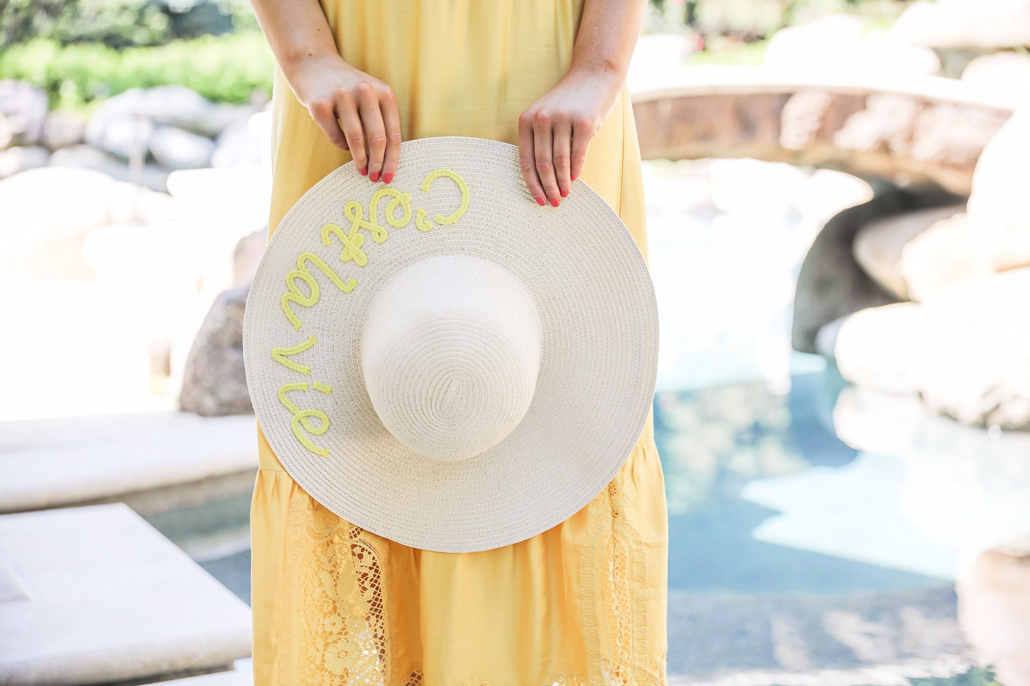 Yellow midi maxi dress poolside with cest la vie quote sun hat on fashion blog daily dose of charm by lauren lindmark