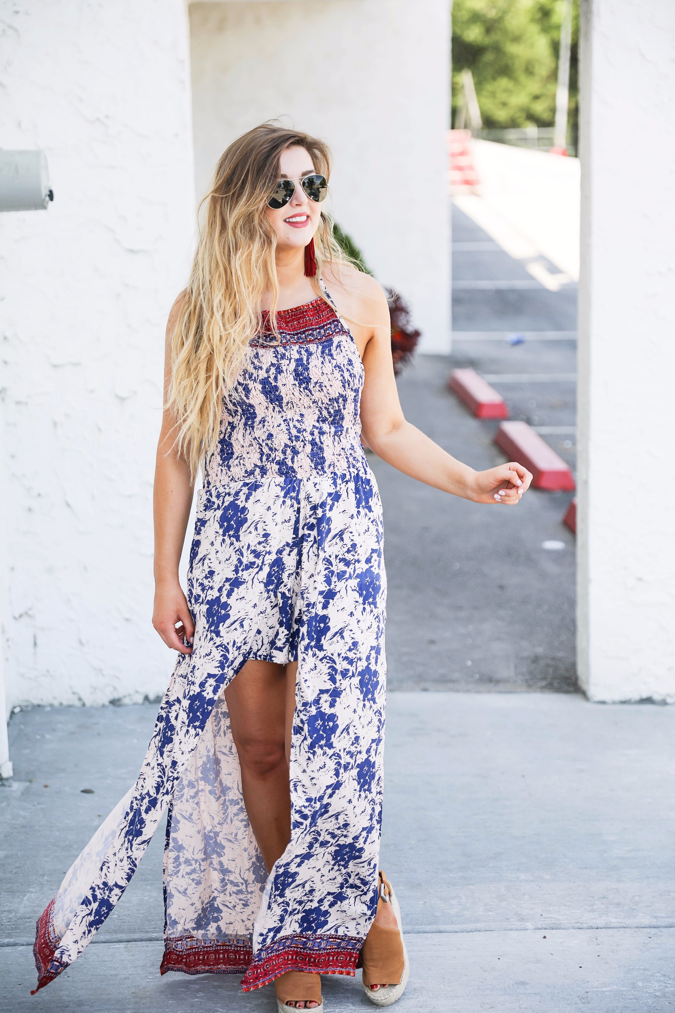 Boho halter romper maxi combo with beachy hair and a bold lip! I also paired these fun burgundy tassel earrings with the look. By fashion blogger lauren lindmakr on daily dose of charm