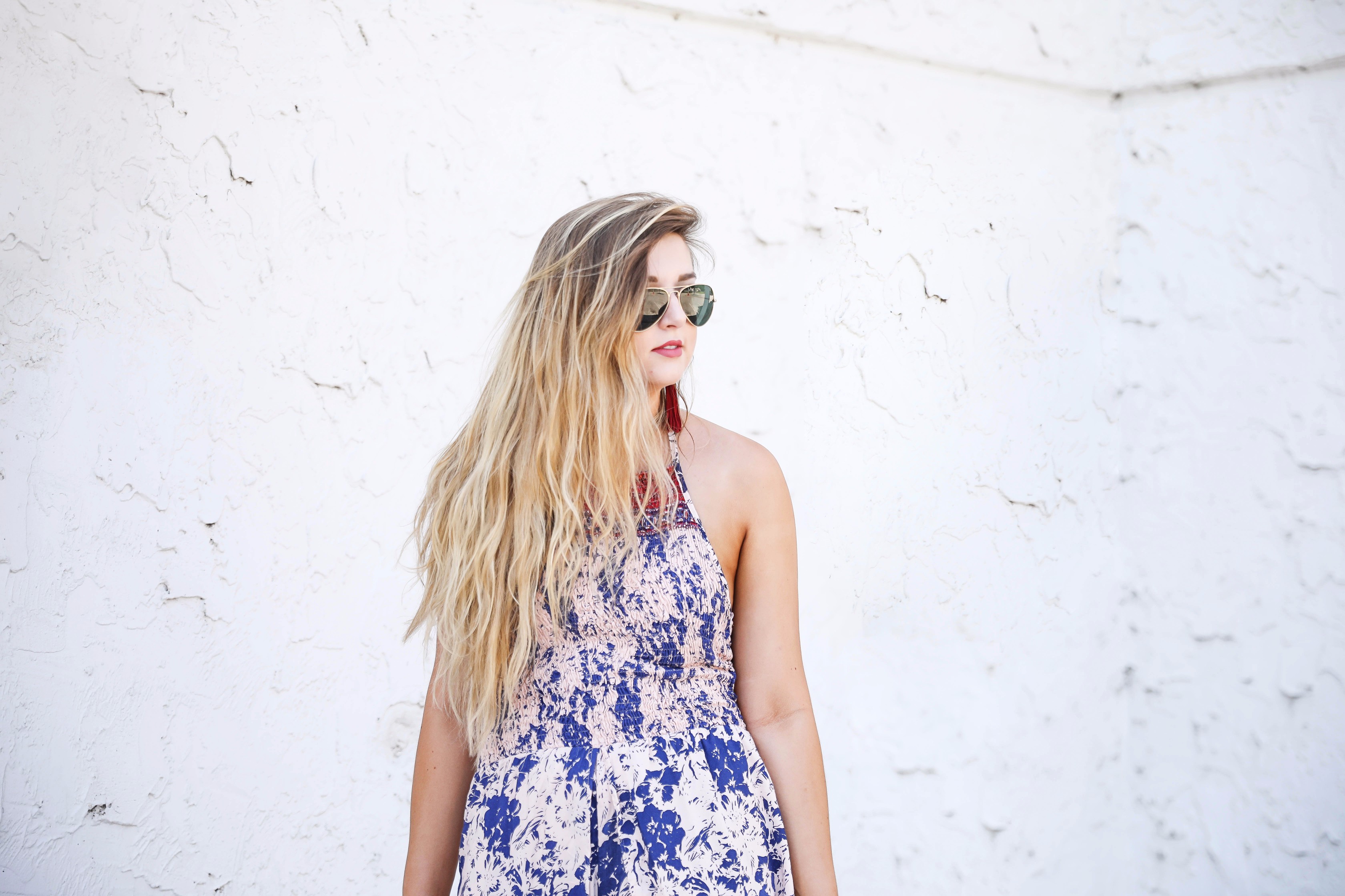 Boho halter romper maxi combo with beachy hair and a bold lip! I also paired these fun burgundy tassel earrings with the look. By fashion blogger lauren lindmakr on daily dose of charm