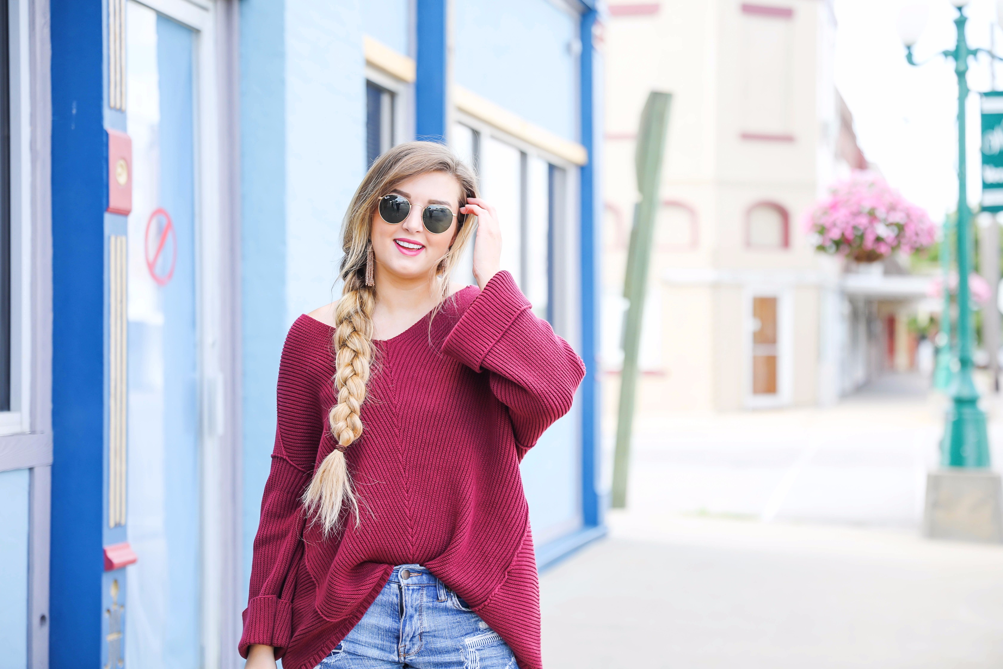 Cutest slouchy burgundy sweater worn with ripped denim shorts. This sweater is from the 2017 nordstrom anniversary sale! By fashion blogger lauren lindmark on daily dose of charm dailydoseofcharm.com