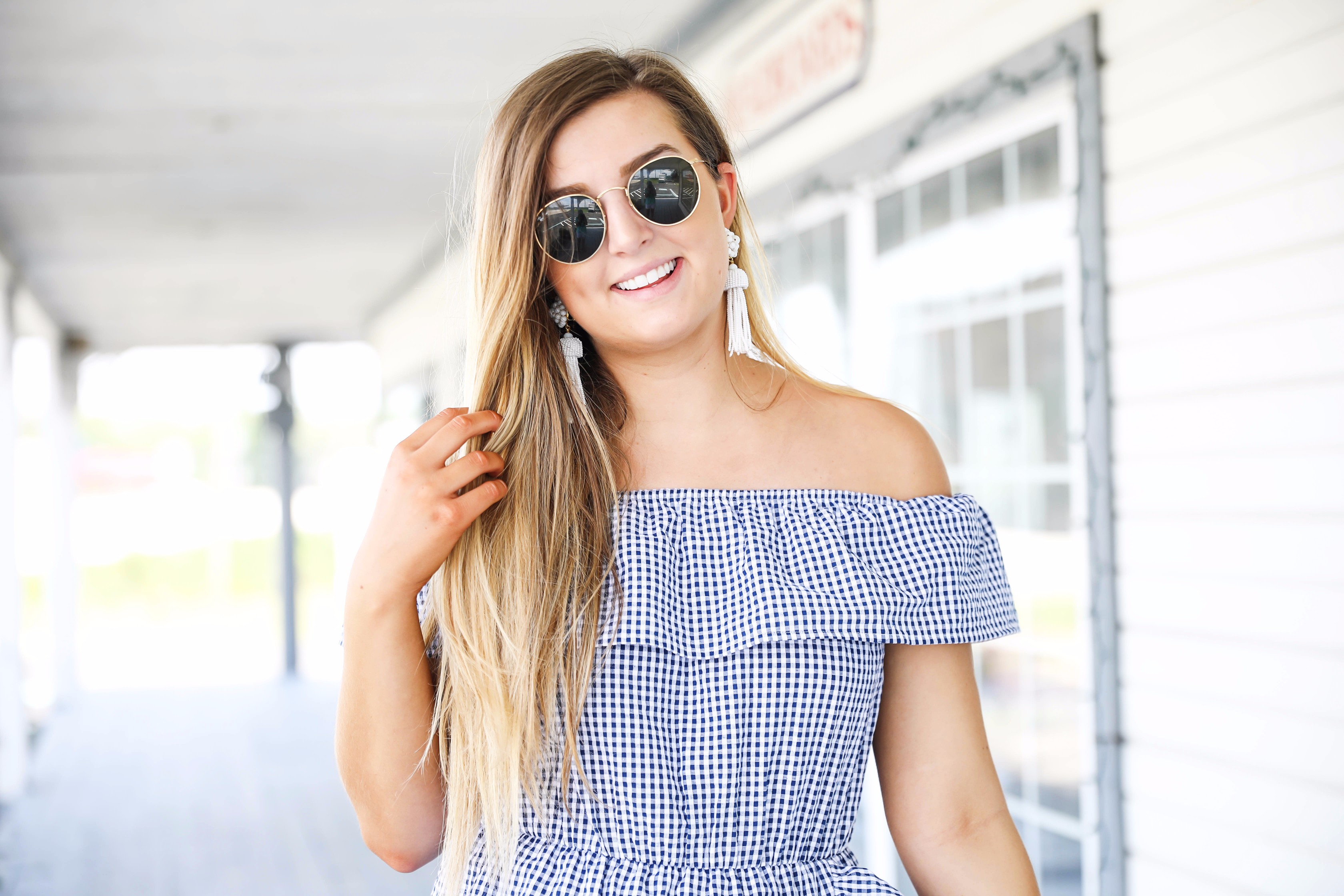 Gingham ruffle dress and round rayb ban sunglasses with tassel earrings on fashion blog daily dose of charm by lauren lindmark