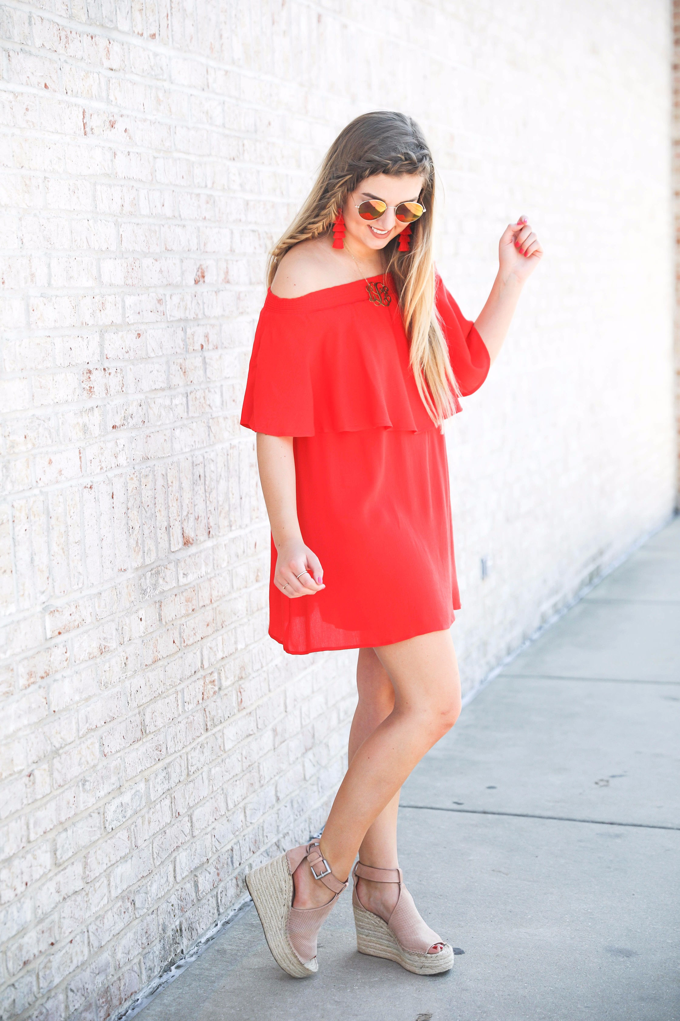 Red off the shoulder dress y Show Me Your MuMu! The cutest dress for summer paired with red tassel earrings, red circle sunglasses, and wedges. Braided fish tail hair. By fashion blogger lauren lindmark daily dose of charm