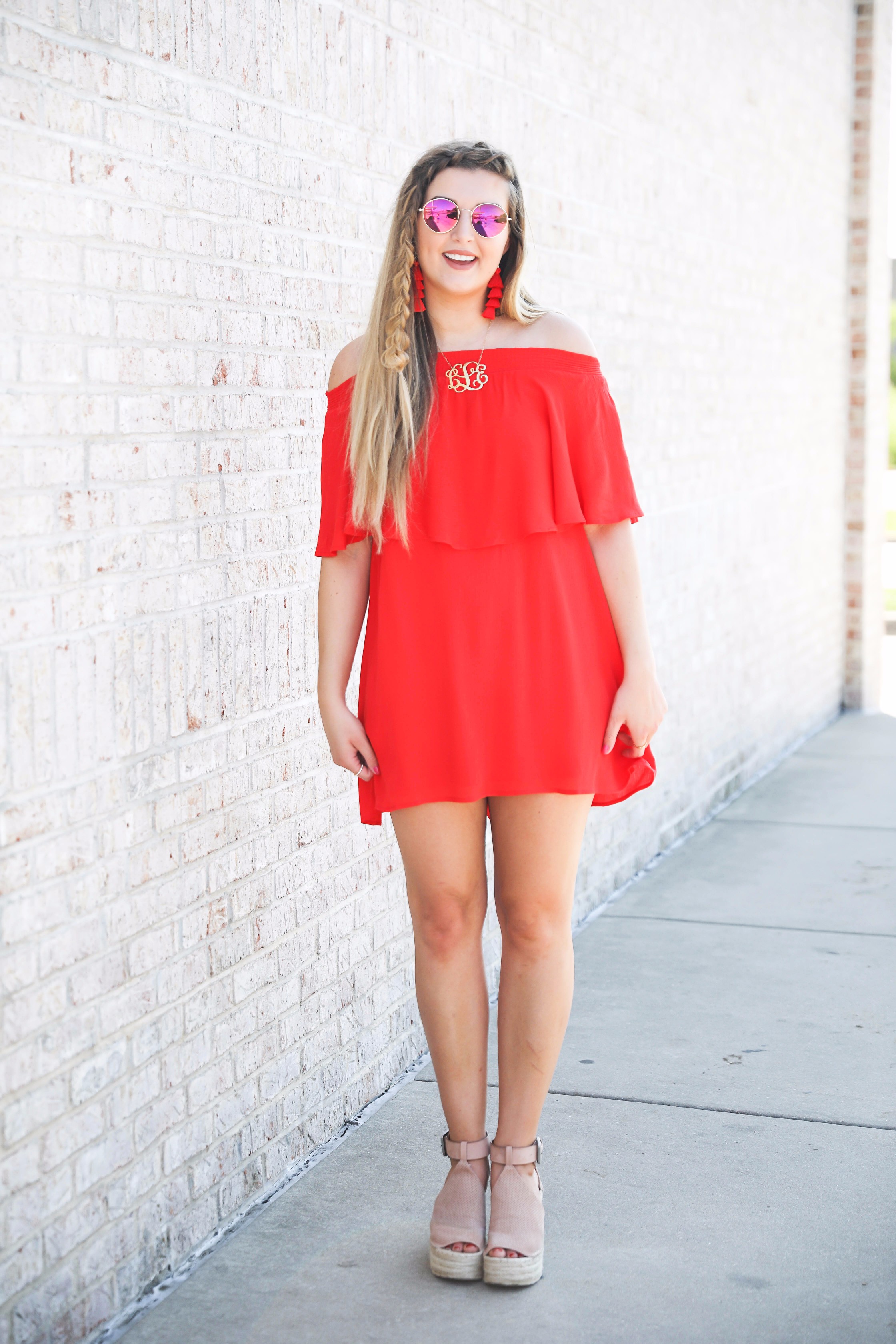 Red off the shoulder dress y Show Me Your MuMu! The cutest dress for summer paired with red tassel earrings, red circle sunglasses, and wedges. Braided fish tail hair. By fashion blogger lauren lindmark daily dose of charm