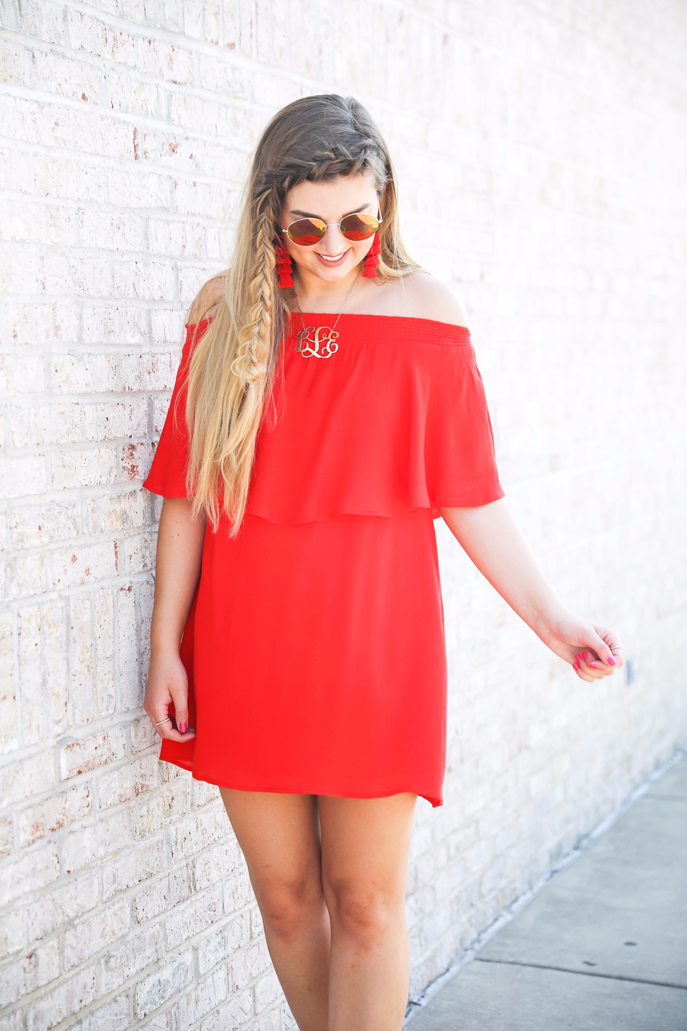 Red off the shoulder dress y Show Me Your MuMu! The cutest dress for summer paired with red tassel earrings, red circle sunglasses, and wedges. Braided fish tail hair. By fashion blogger lauren lindmark daily dose of charm