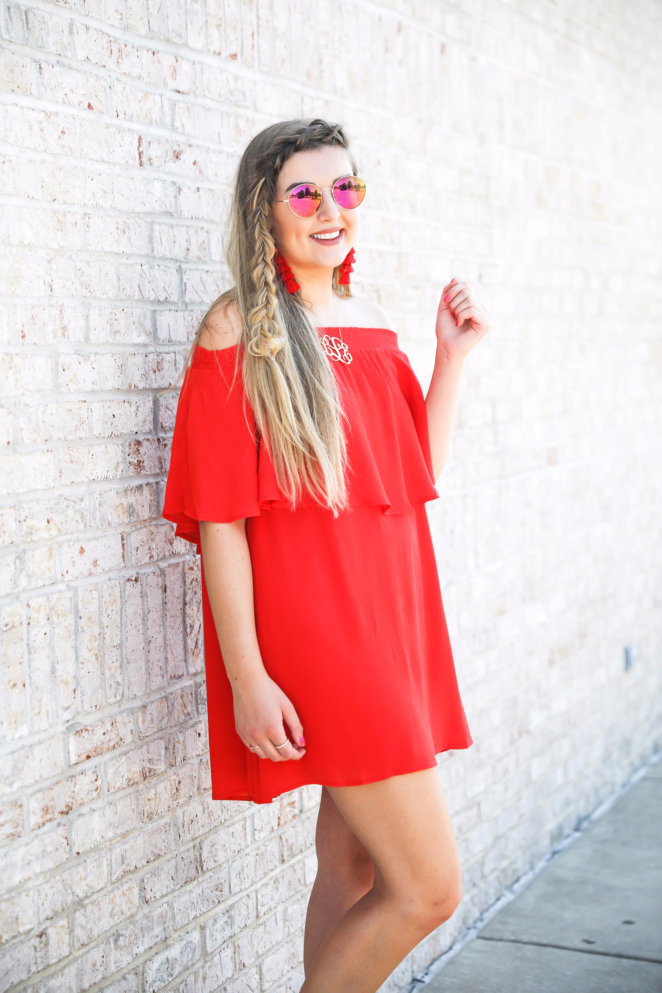 Red off the shoulder dress y Show Me Your MuMu! The cutest dress for summer paired with red tassel earrings, red circle sunglasses, and wedges. Braided fish tail hair. By fashion blogger lauren lindmark daily dose of charm