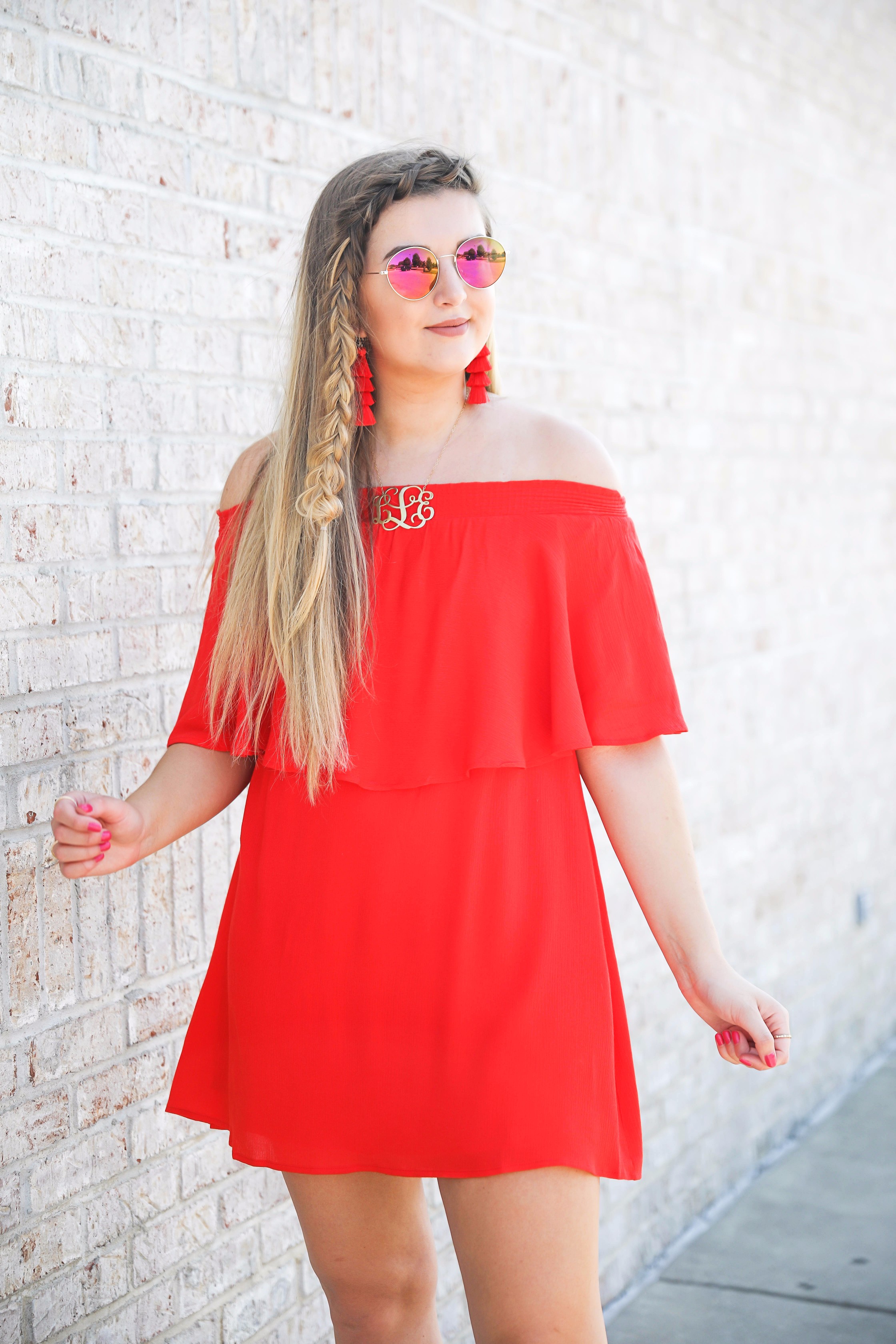Red off the shoulder dress y Show Me Your MuMu! The cutest dress for summer paired with red tassel earrings, red circle sunglasses, and wedges. Braided fish tail hair. By fashion blogger lauren lindmark daily dose of charm