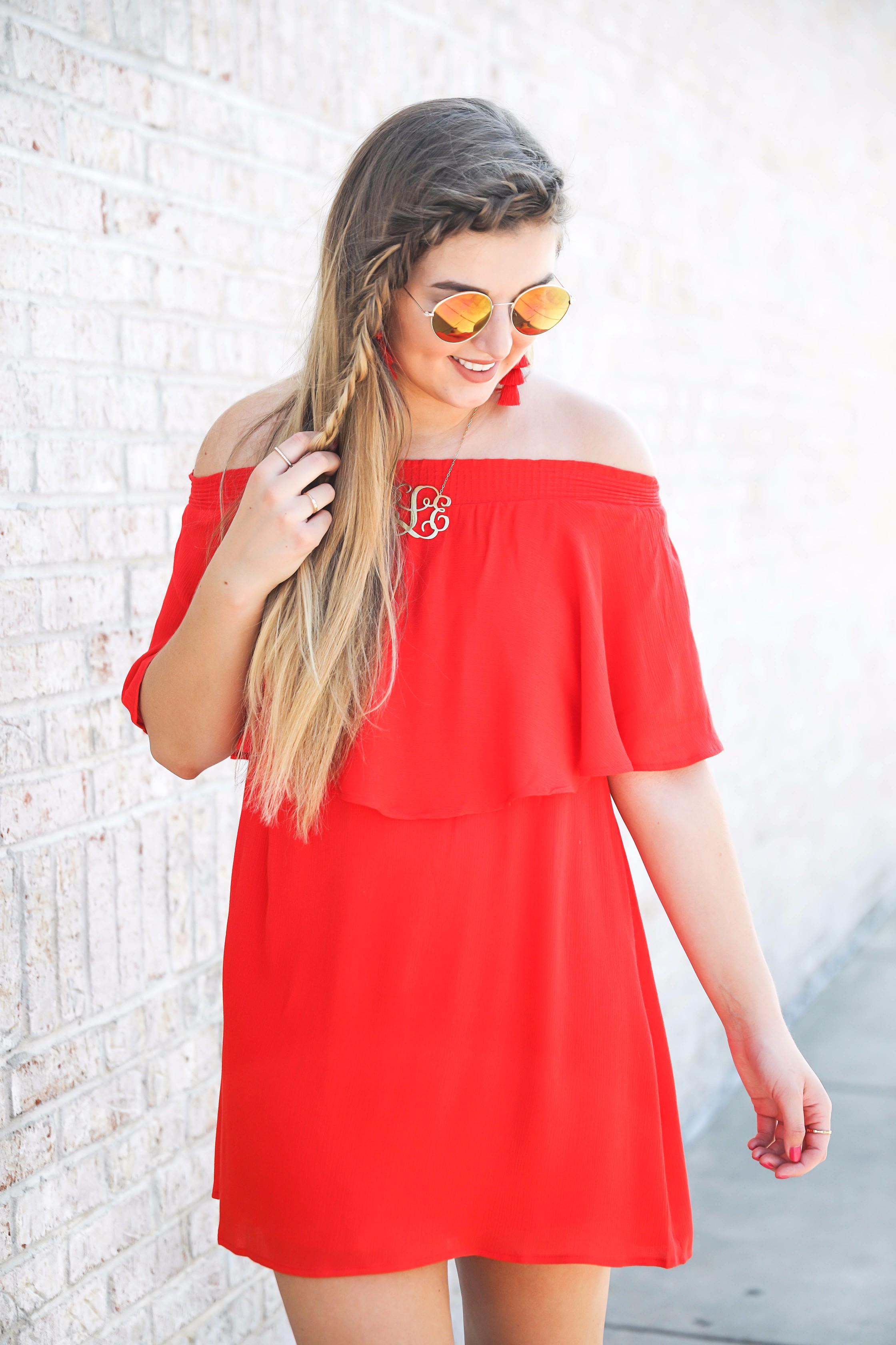 Red off the shoulder dress y Show Me Your MuMu! The cutest dress for summer paired with red tassel earrings, red circle sunglasses, and wedges. Braided fish tail hair. By fashion blogger lauren lindmark daily dose of charm