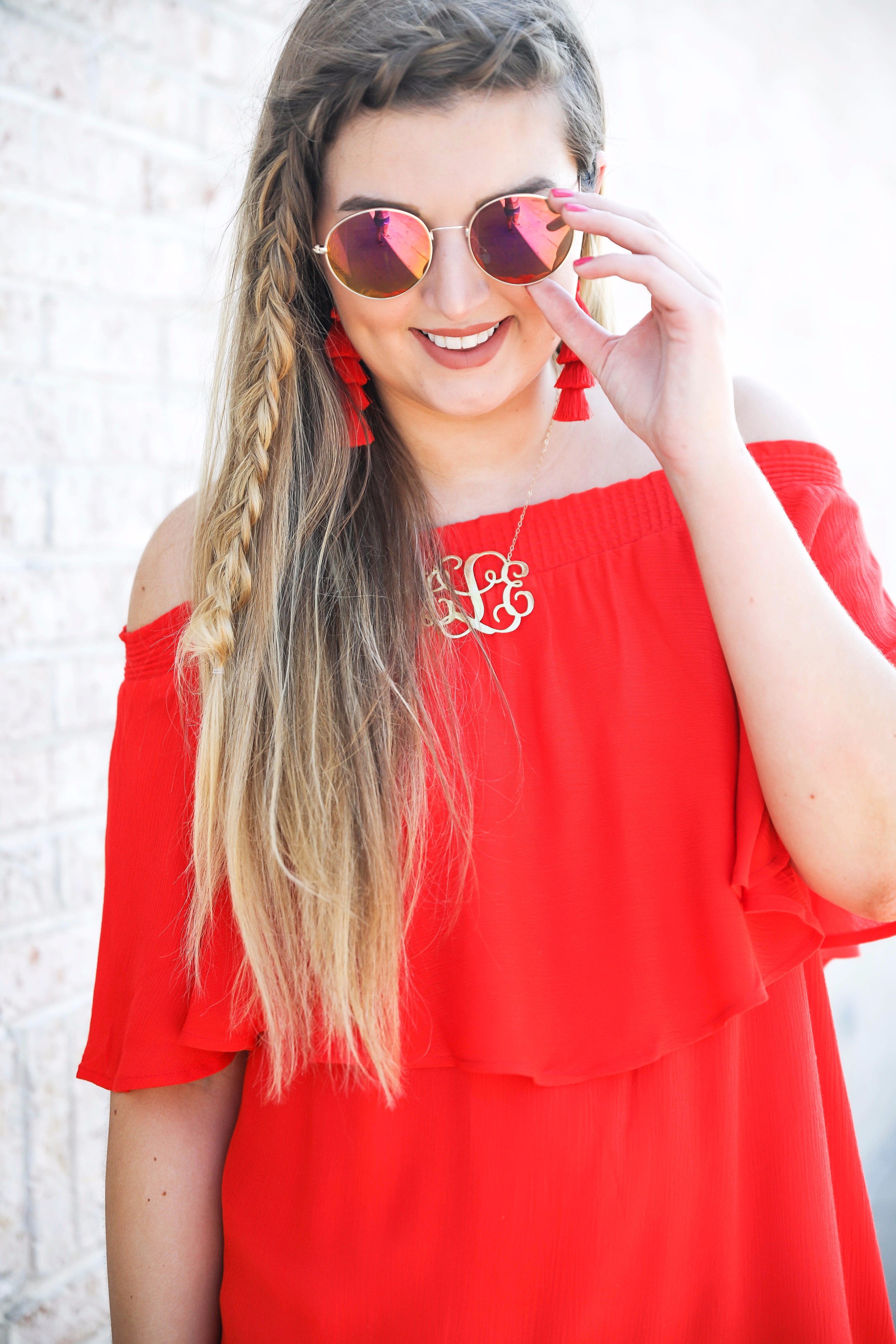 Red off the shoulder dress y Show Me Your MuMu! The cutest dress for summer paired with red tassel earrings, red circle sunglasses, and wedges. Braided fish tail hair. By fashion blogger lauren lindmark daily dose of charm