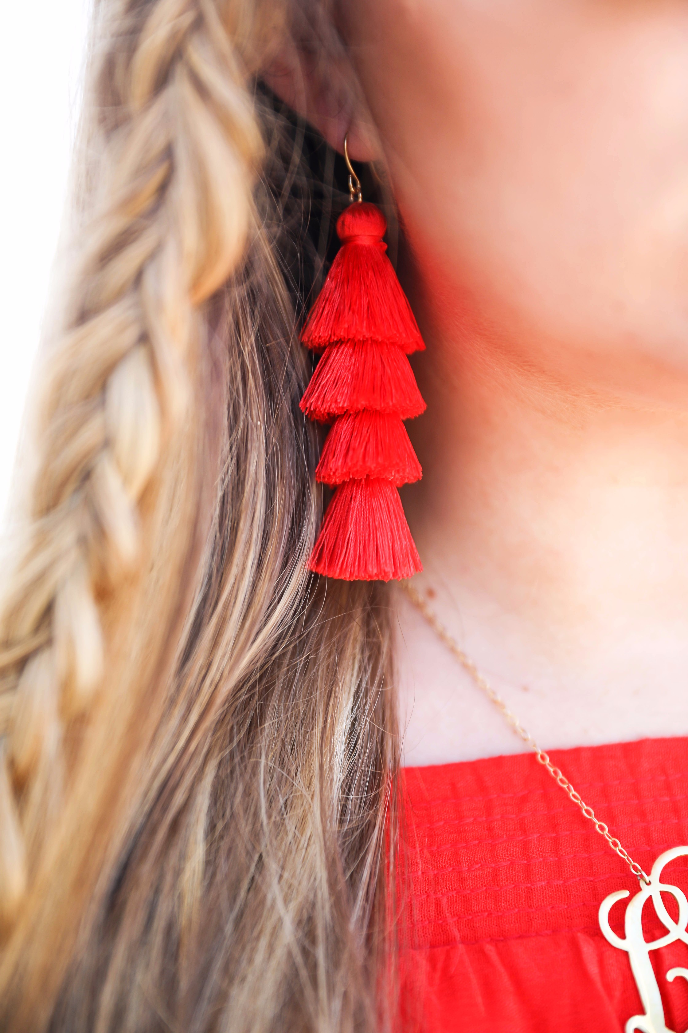 Red off the shoulder dress y Show Me Your MuMu! The cutest dress for summer paired with red tassel earrings, red circle sunglasses, and wedges. Braided fish tail hair. By fashion blogger lauren lindmark daily dose of charm