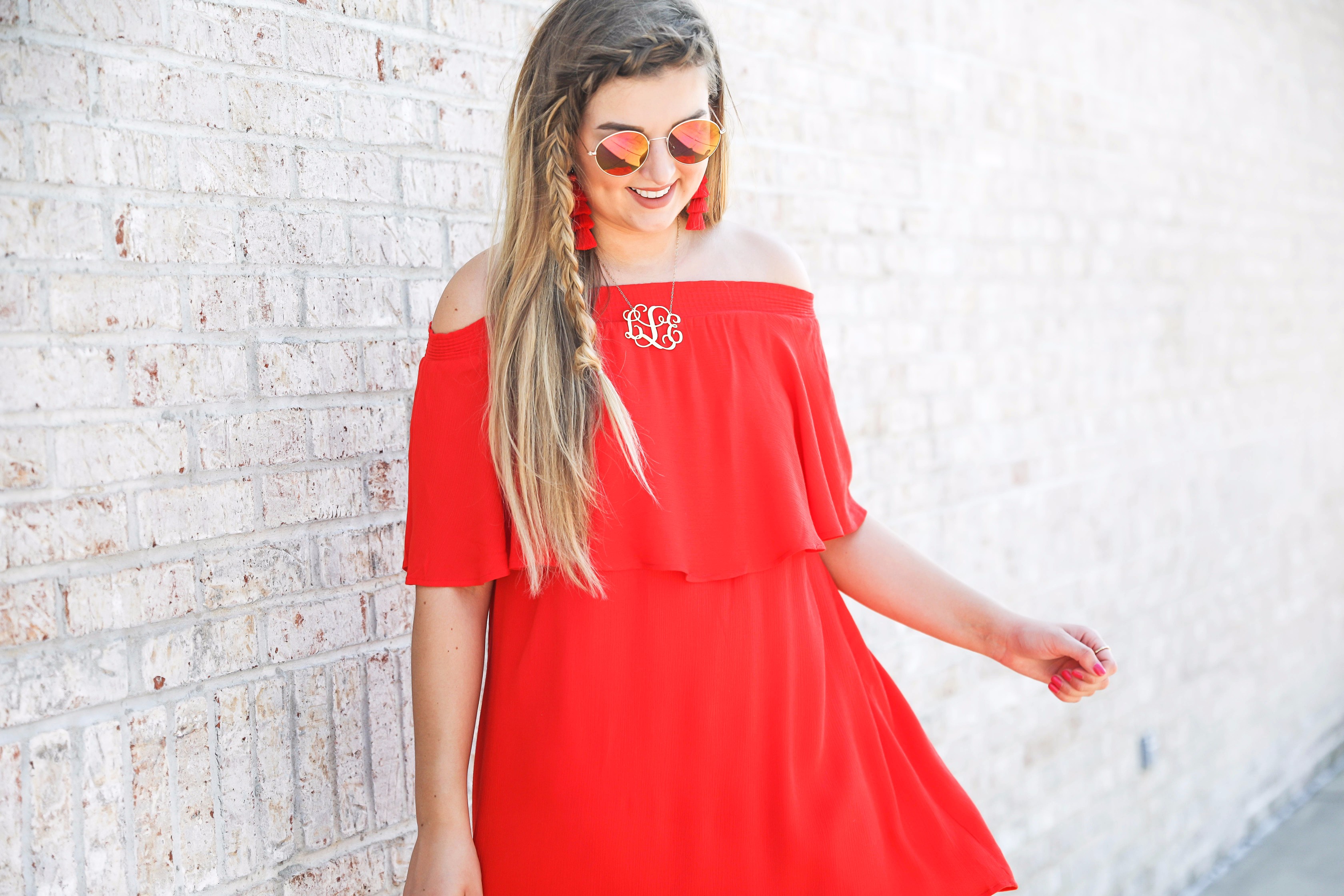 Red off the shoulder dress y Show Me Your MuMu! The cutest dress for summer paired with red tassel earrings, red circle sunglasses, and wedges. Braided fish tail hair. By fashion blogger lauren lindmark daily dose of charm