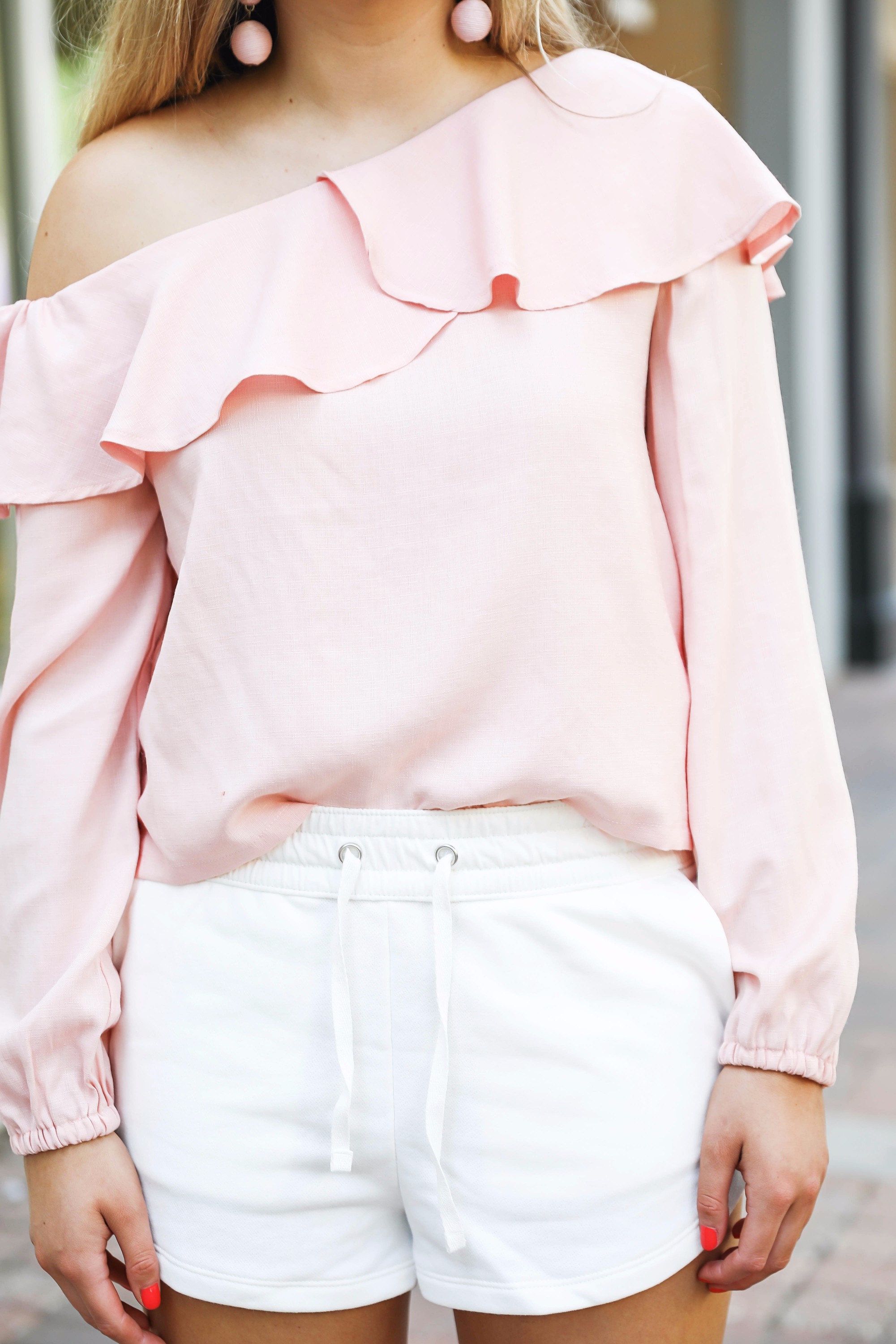 Casual outfit! I love this pink ruffle top with my favorite white sweatshorts that are only $13! On fashion blog daily dose of charm by lauren lindmark