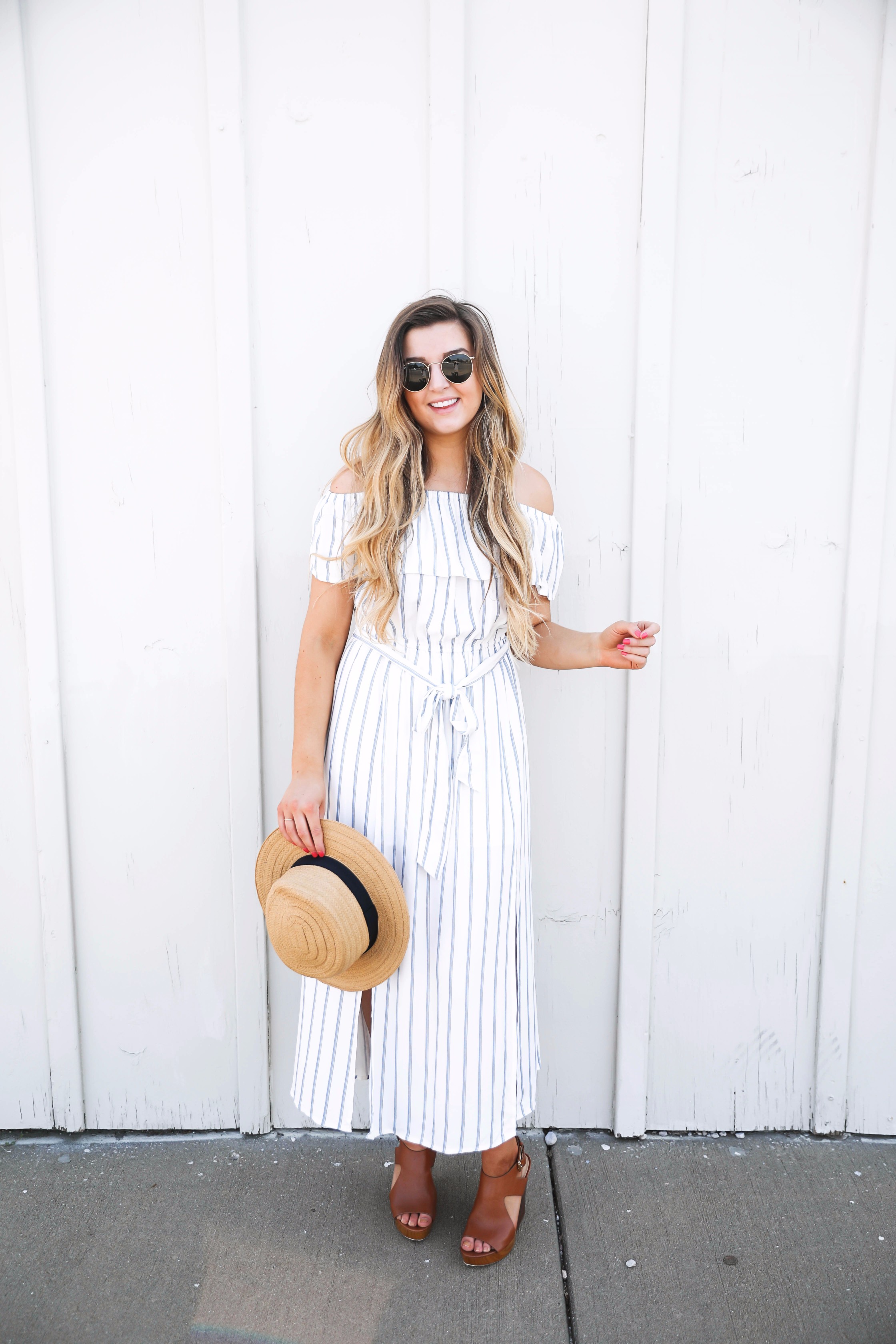 Navy and white striped off the shoulder boardwalk dress! I paired it with a cute boat hat and clubmasters! By fashion blogger daily dose of charm lauren lindmark