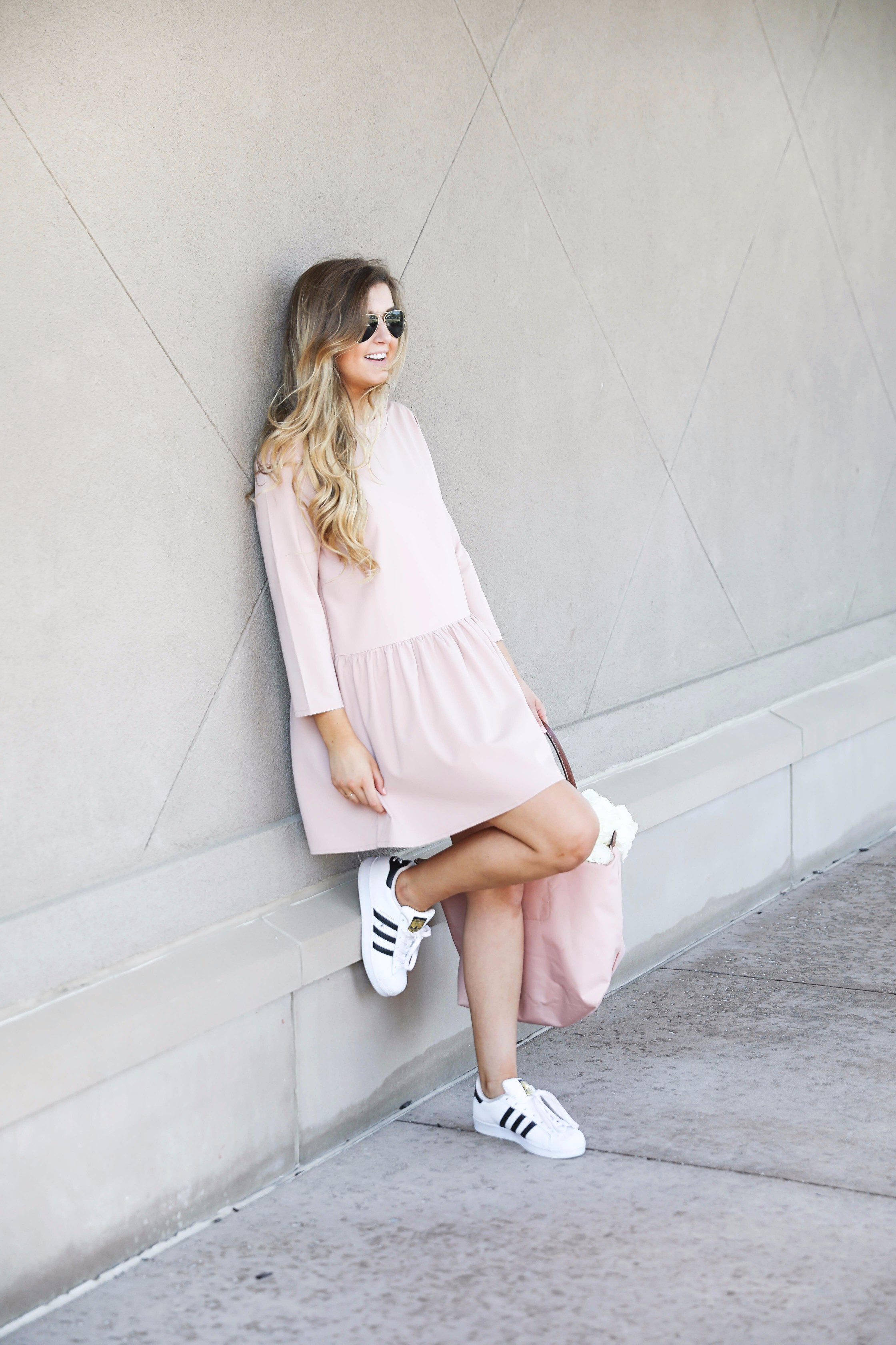 Pink drop waist dress with Adidas sneakers! Such a cute and casual look. I paired it with my favorite light pink longchamp with hydrangeas! By fashion blog daily dose of charm lauren lindmark