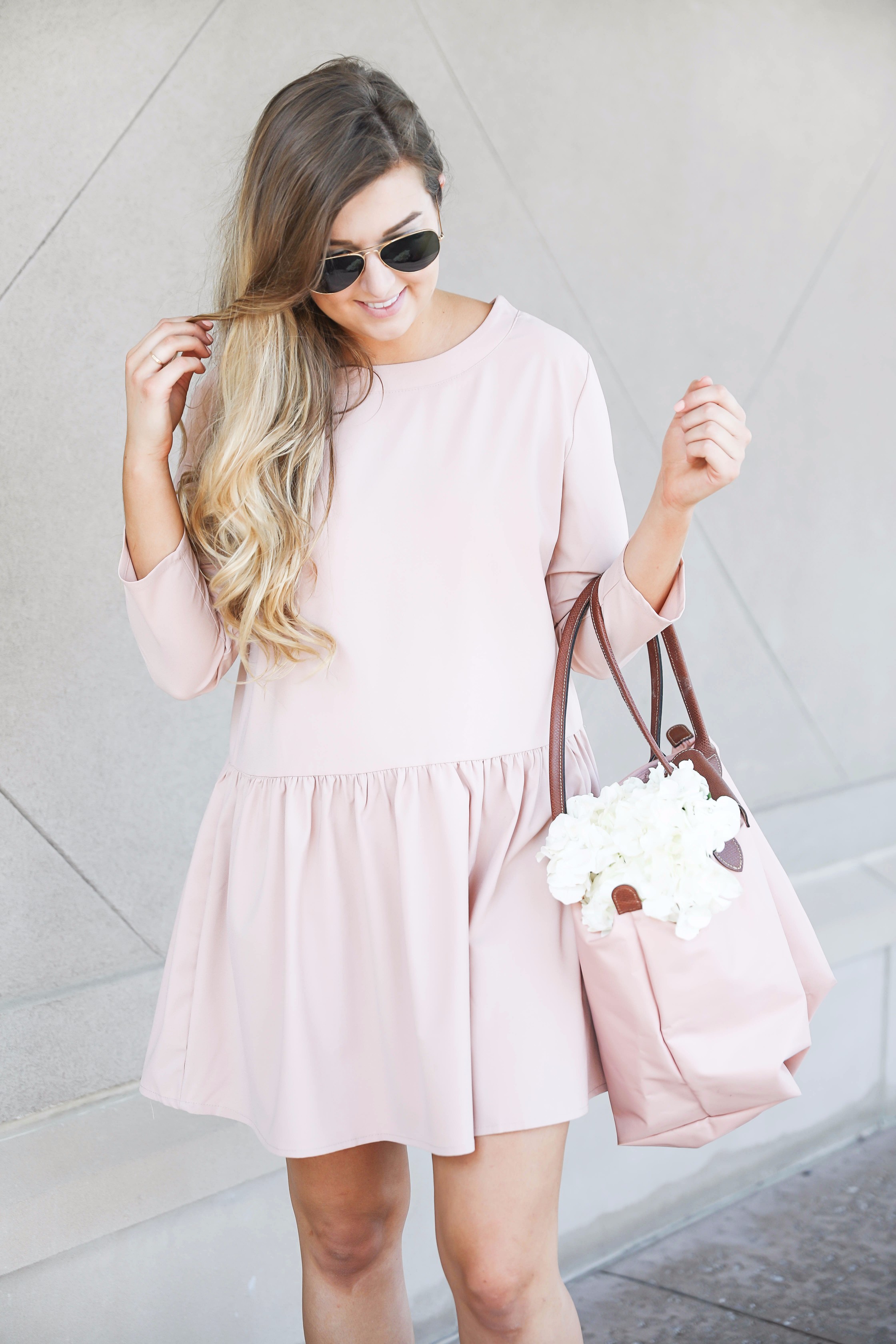 Pink drop waist dress with Adidas sneakers! Such a cute and casual look. I paired it with my favorite light pink longchamp with hydrangeas! By fashion blog daily dose of charm lauren lindmark