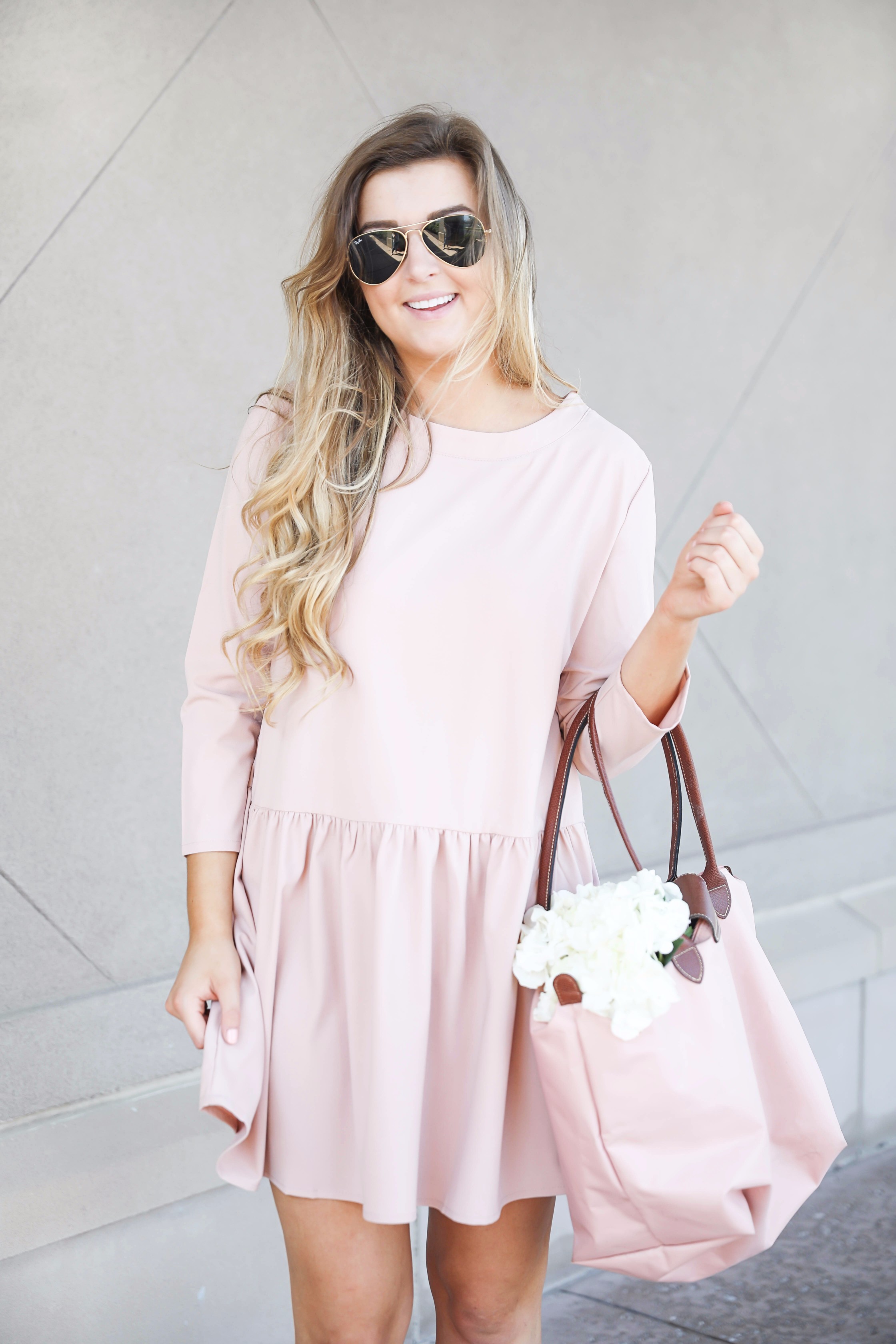 Pink drop waist dress with Adidas sneakers! Such a cute and casual look. I paired it with my favorite light pink longchamp with hydrangeas! By fashion blog daily dose of charm lauren lindmark