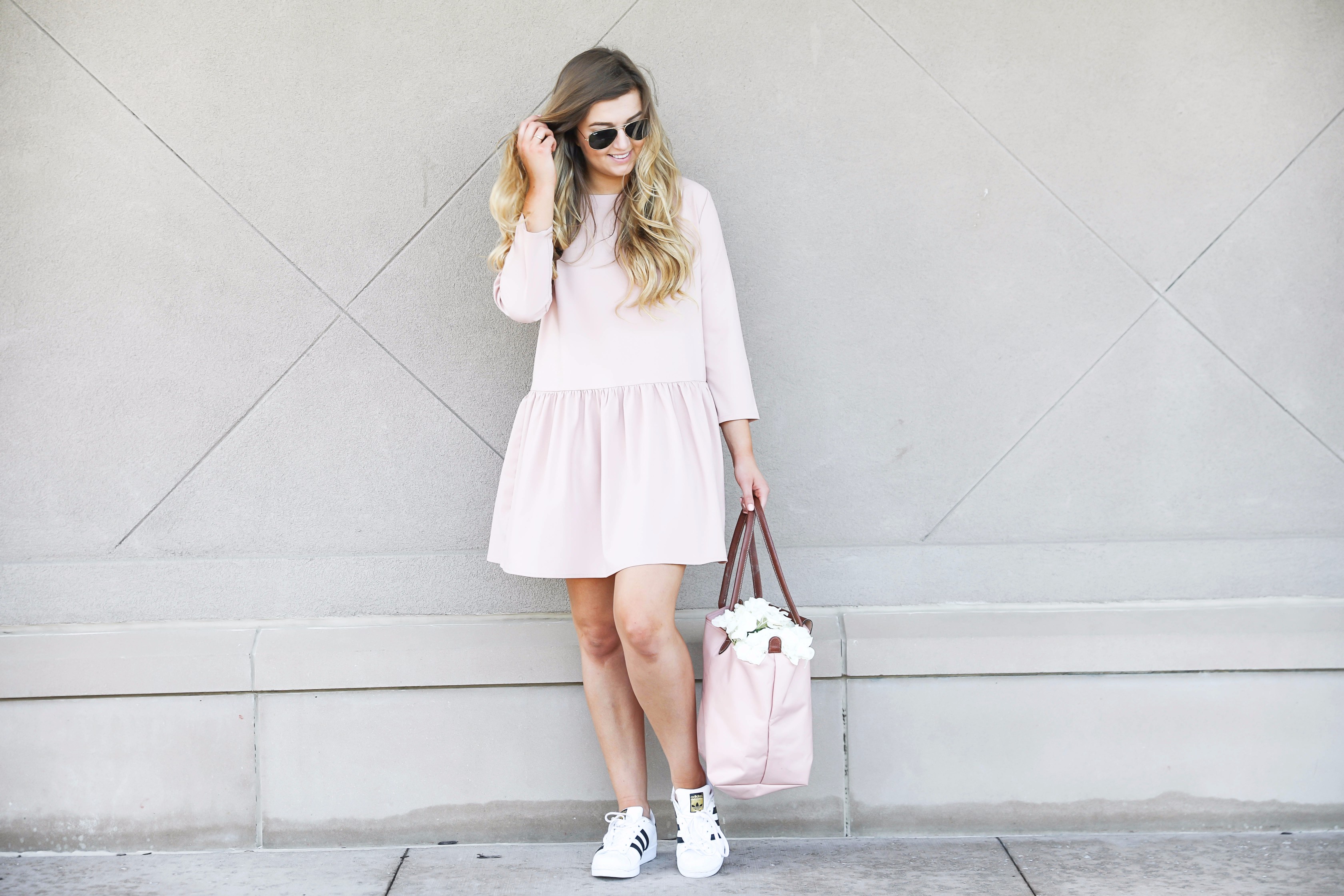 Pink drop waist dress with Adidas sneakers! Such a cute and casual look. I paired it with my favorite light pink longchamp with hydrangeas! By fashion blog daily dose of charm lauren lindmark