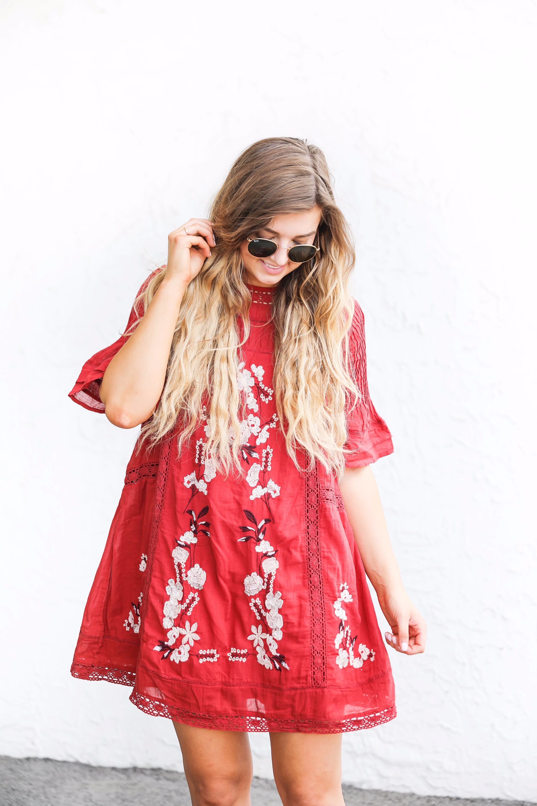 Red free people fall dress! I love this bright red color for fall. There are so many ways to wear this! It would be super cute with boots or booties! by fashion blogger lauren lindmark on daily dose of charm