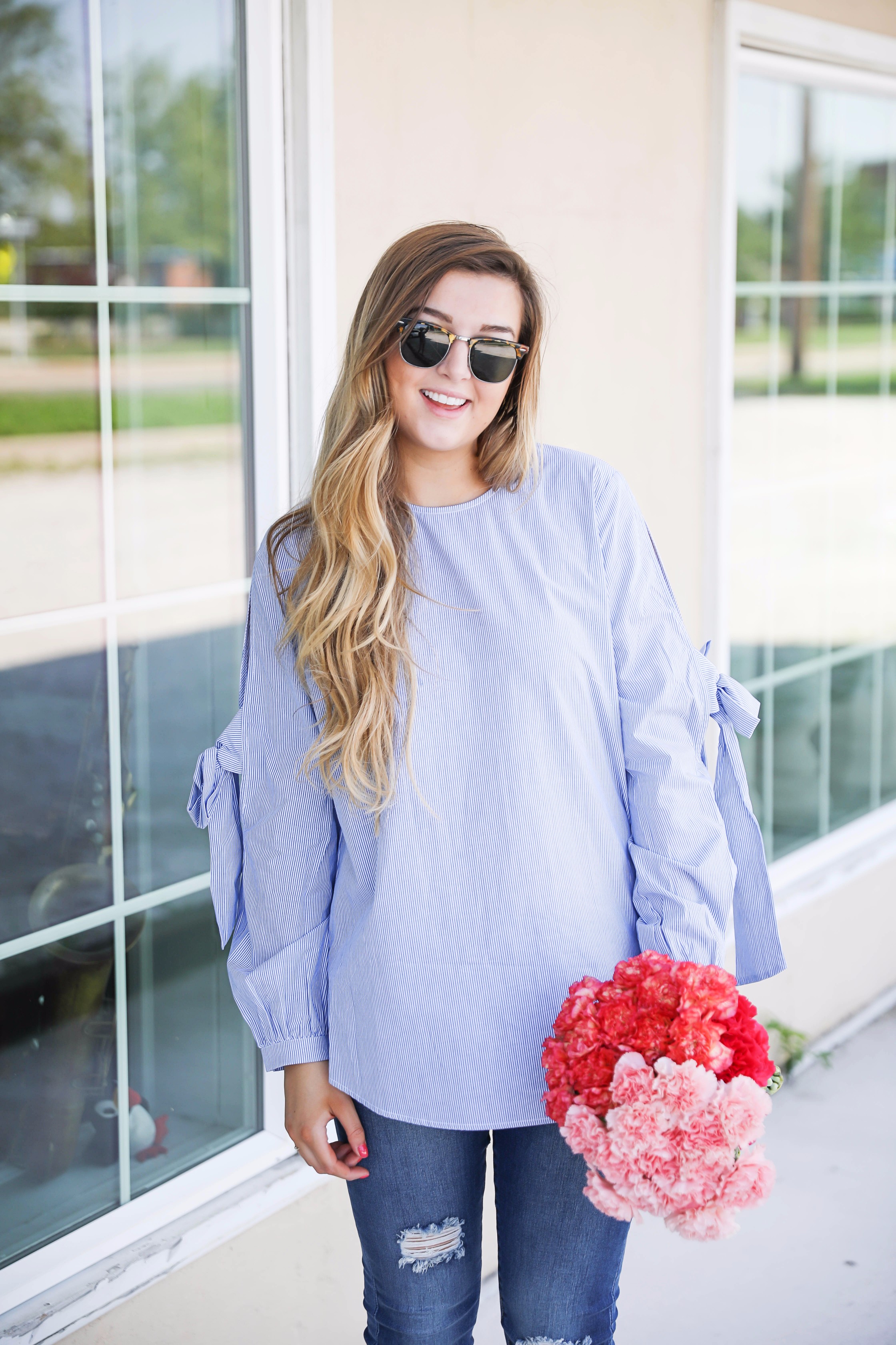 Seersucker bow sleeve cold shoulder top and tape in extensions! The prettiest flowers with the cutest outfit! on fashion blog daily dose of charm by lauren lindmark