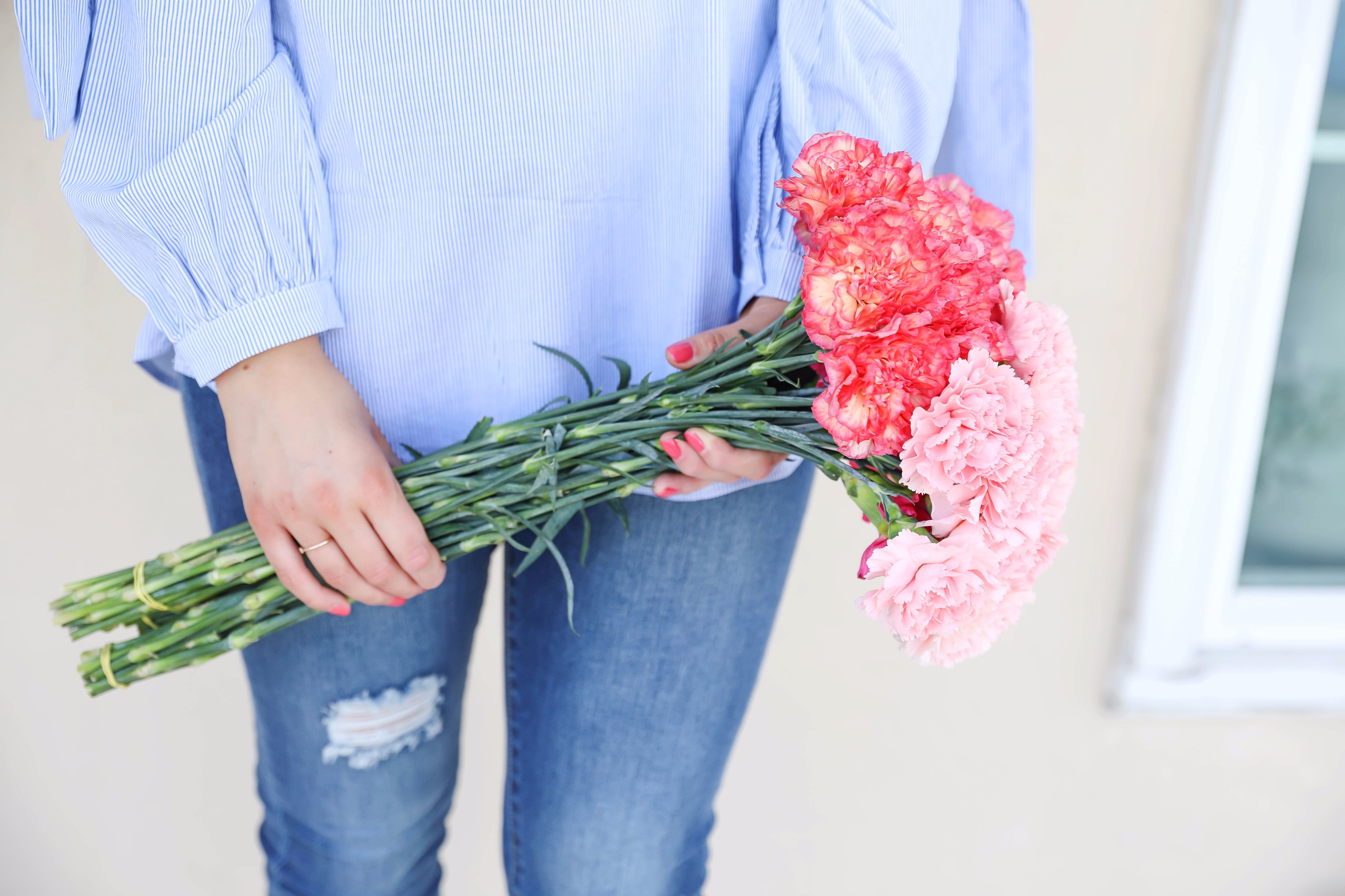 Seersucker bow sleeve cold shoulder top and tape in extensions! The prettiest flowers with the cutest outfit! on fashion blog daily dose of charm by lauren lindmark