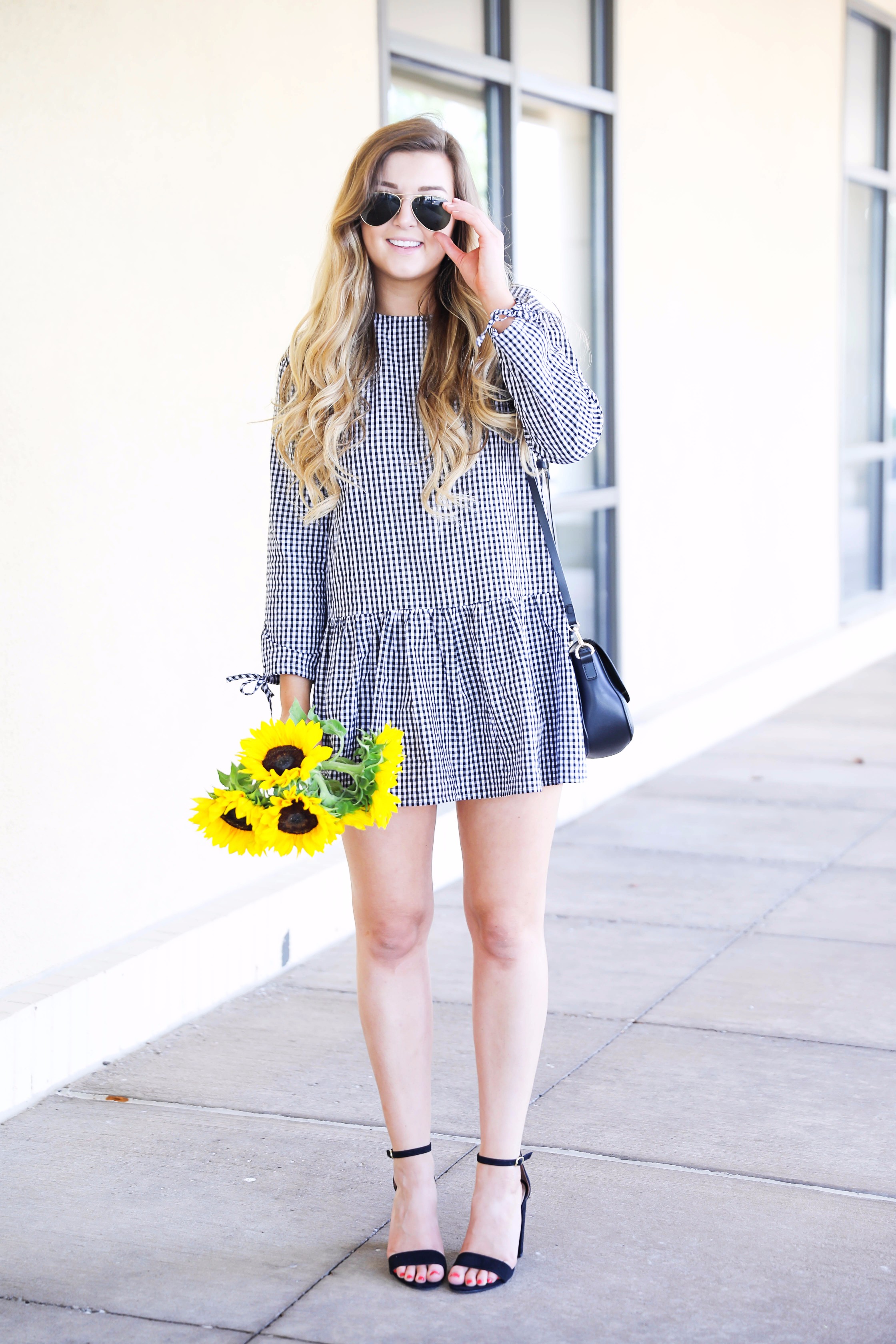 Sunflowers and gingham! The cutest low waist dress for summer transiting into fall. I can't get enough of this cute gingham dress! More details on fashion blog daily dose of charm by lauren lindmark
