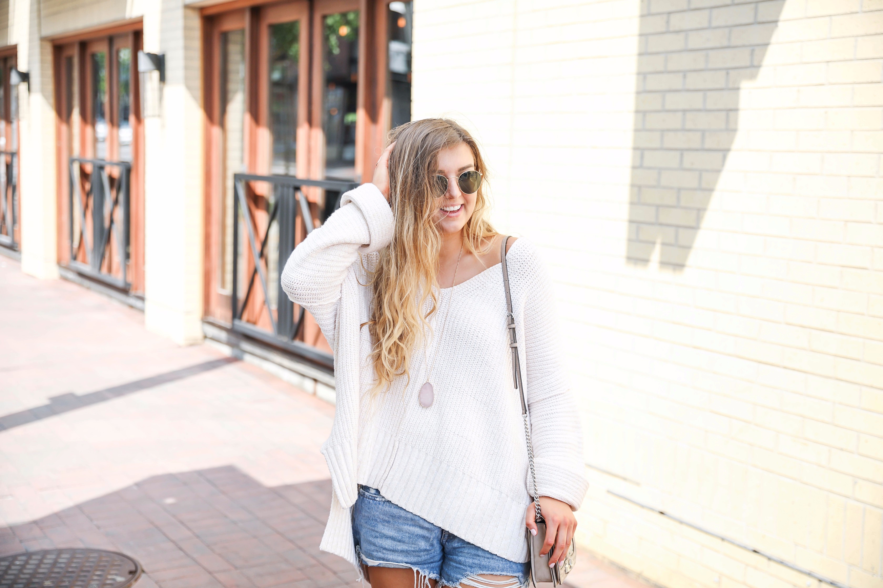 The cutest and comfiest white oversized free people sweater on fashion blog daily dose of charm by lauren lindmark