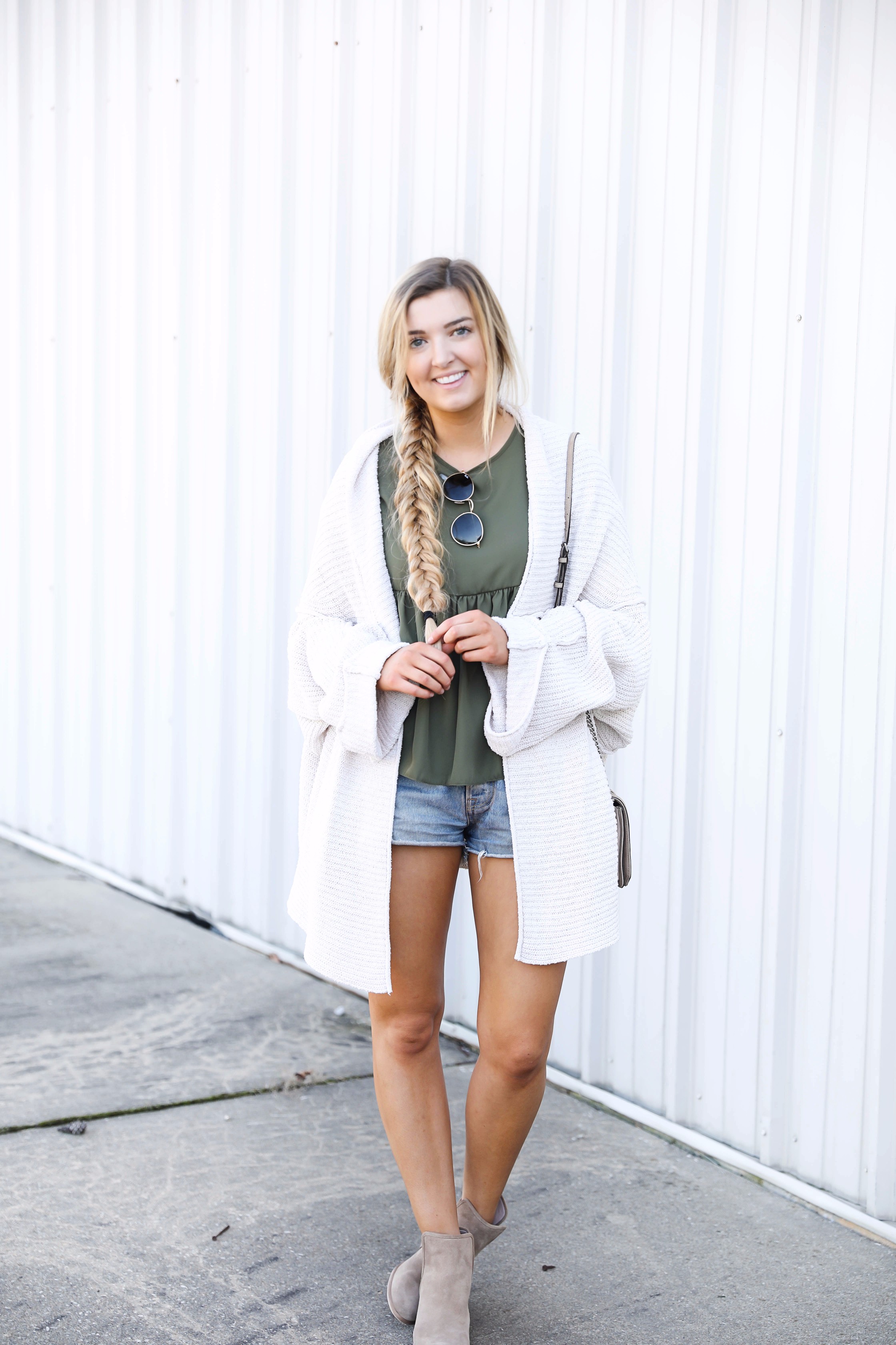 Olive ruffle top with a free people slouchy cardigan! I love olive for fall. This look is autumn perfection with the booties! Find the details on fashion blog daily dose of charm by lauren lindmark