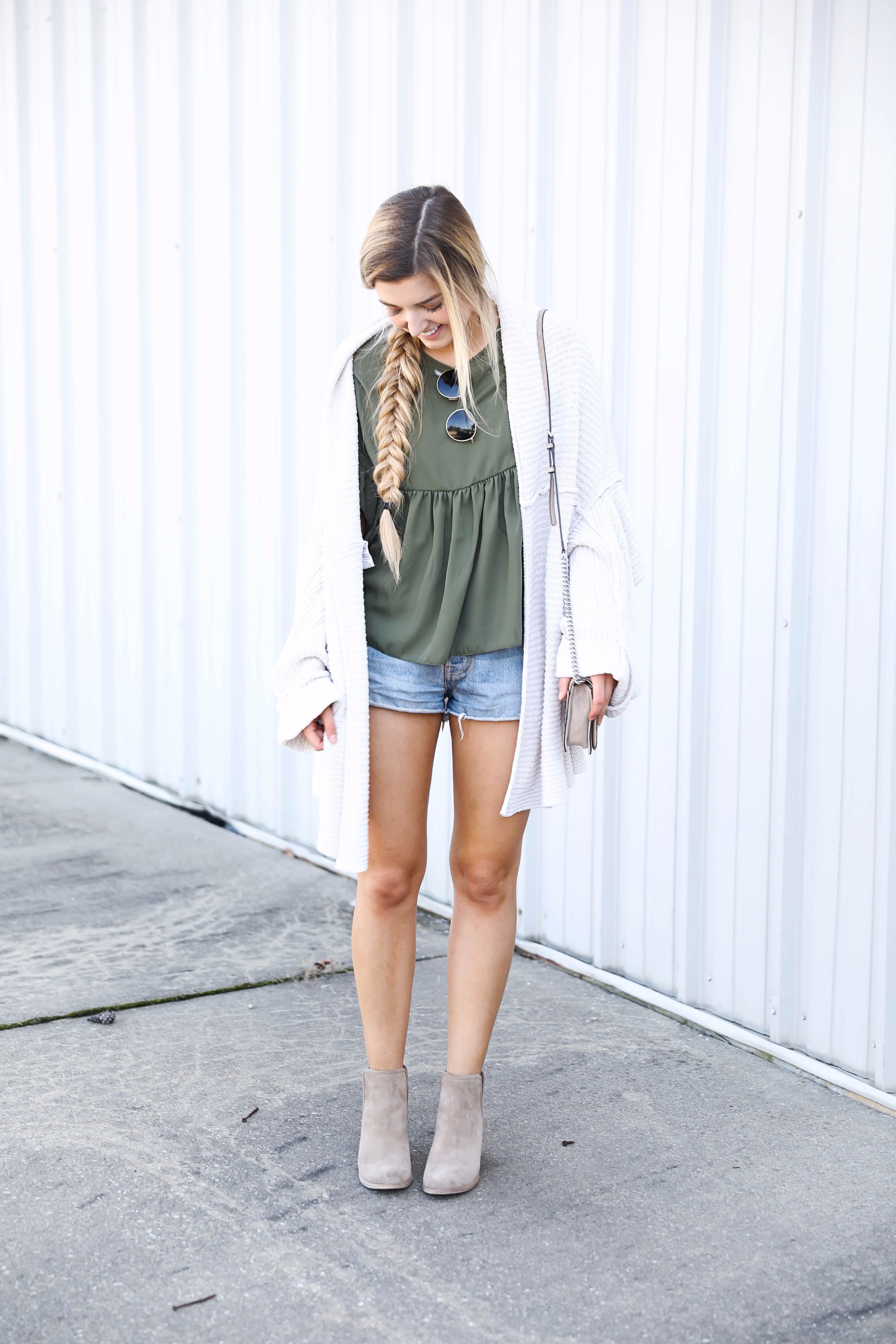 Olive ruffle top with a free people slouchy cardigan! I love olive for fall. This look is autumn perfection with the booties! Find the details on fashion blog daily dose of charm by lauren lindmark