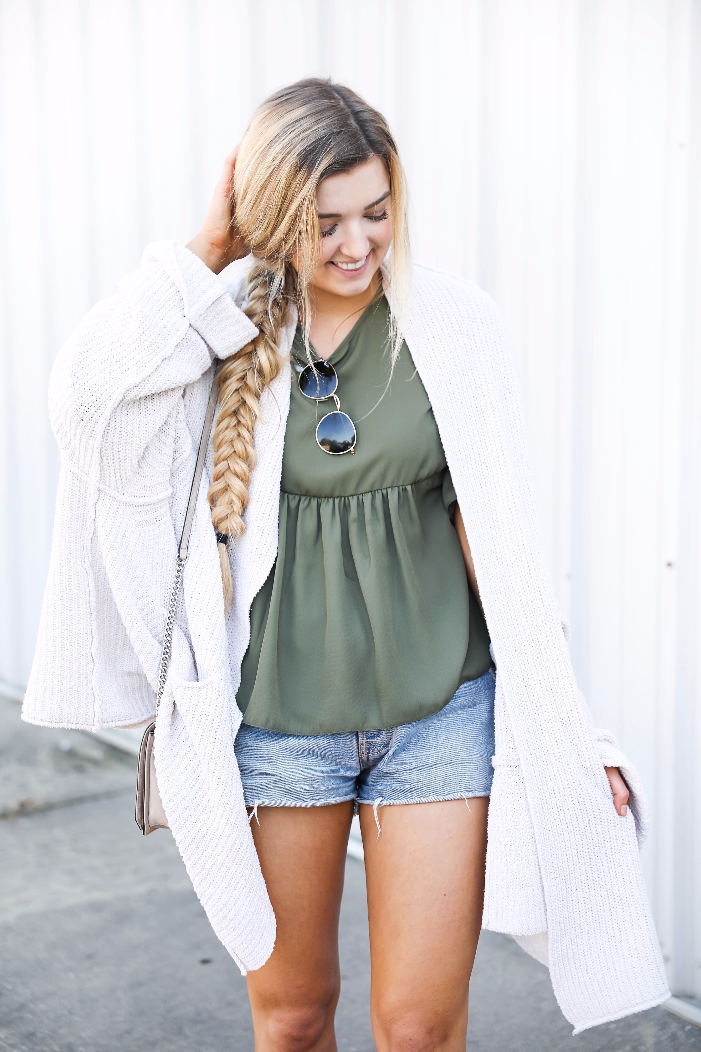 Olive ruffle top with a free people slouchy cardigan! I love olive for fall. This look is autumn perfection with the booties! Find the details on fashion blog daily dose of charm by lauren lindmark